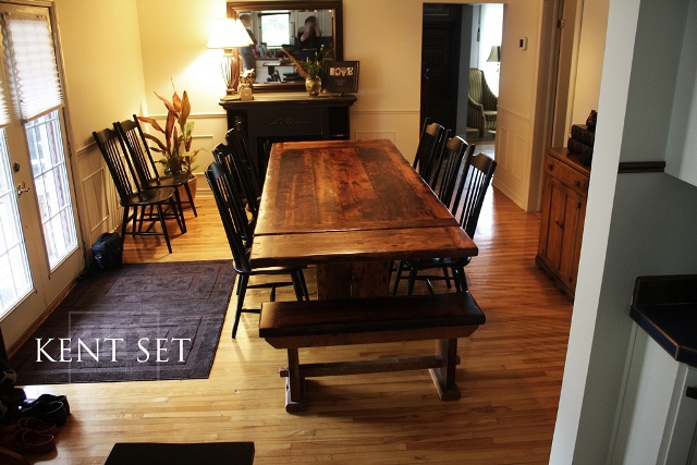 7 ft Trestle Table - 42" wide - Premium epoxy/matte polyurethane finish - Reclaimed Threshing Floor 2" Hemlock Top - Two 18" leaf extensions [making total length 9 ft when extended] - Two [matching] 42" benches - 8 Black Buckhorn chairs finish in black