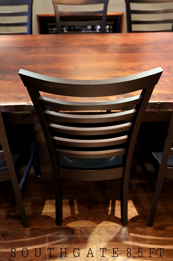 Details of Dining Set: 8.5 ft Trestle Table - Violin Shaped Base - 46" wide - Reclaimed Threshing Floor Hemlock 2" top - Premium epoxy and matte polyurethane finish - One 18" leaf - 8 Mill style chairs (black with sandthroughs + polyurethane clearcoat finish) - Two 46" trestle style benches Gerald Reinink