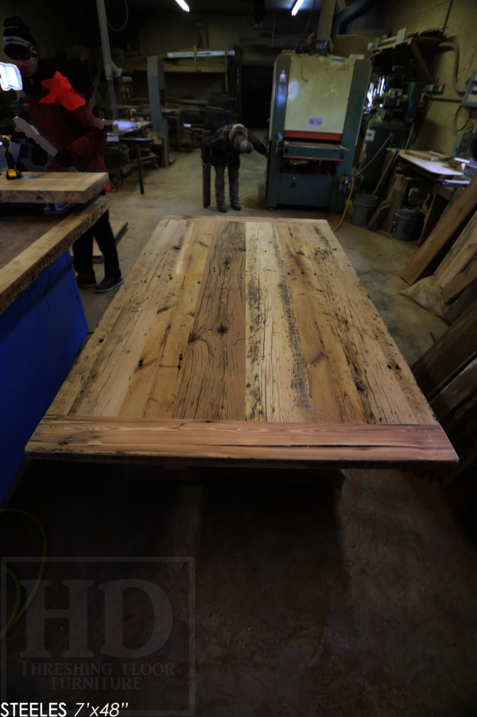 7' Reclaimed Wood Boardroom Table - 48" wide - Hemlock Threshing Floor Construction - Original edges & distressing maintained - Premium epoxy + satin polyurethane finish - Matte Black Metal Base - www.hdthreshing.com