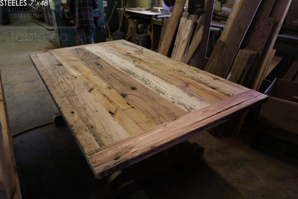 7' Reclaimed Wood Boardroom Table - 48" wide - Hemlock Threshing Floor Construction - Original edges & distressing maintained - Premium epoxy + satin polyurethane finish - Matte Black Metal Base - www.hdthreshing.com