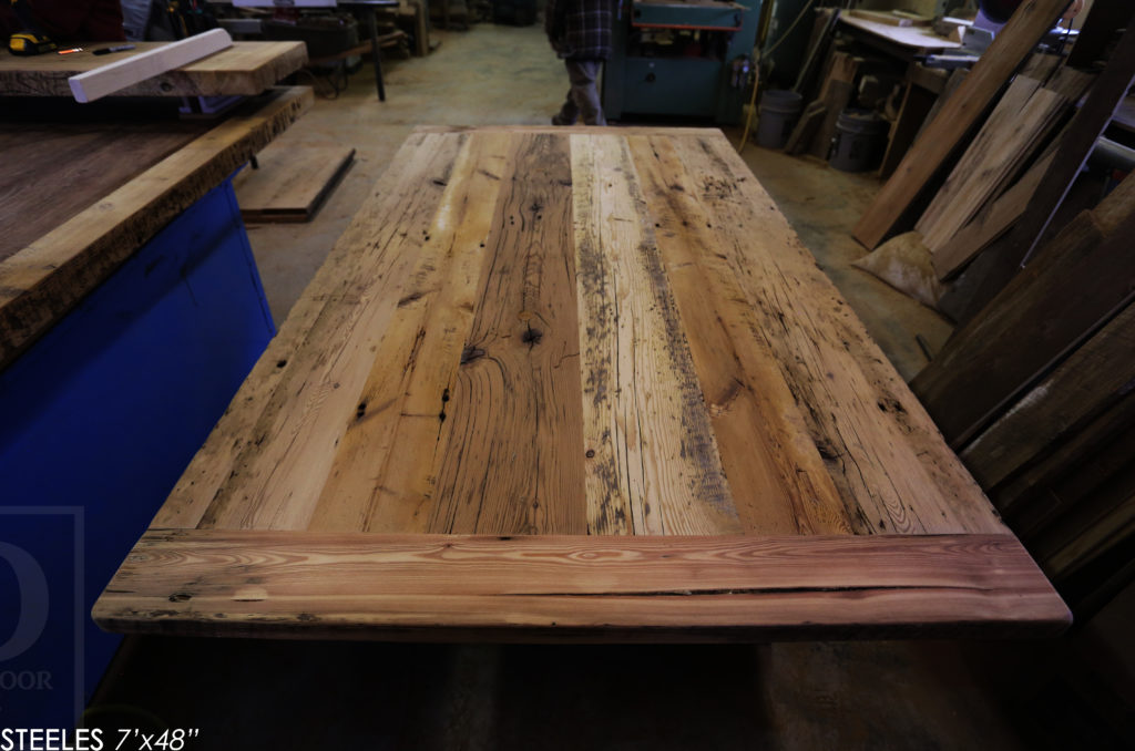 7' Reclaimed Wood Boardroom Table - 48" wide - Hemlock Threshing Floor Construction - Original edges & distressing maintained - Premium epoxy + satin polyurethane finish - Matte Black Metal Base - www.hdthreshing.com