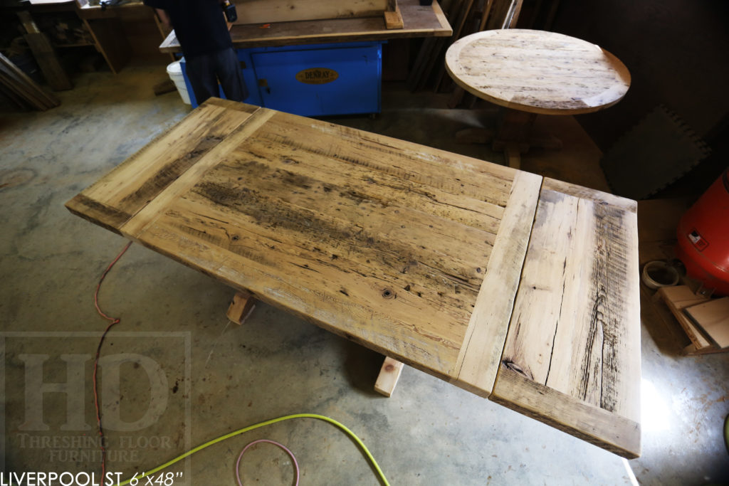 6' Reclaimed Wood Table for Oakville home - 48" wide - Sawbuck Base - Hemlock Threshing Floor Construction - Original edges & distressing maintained - Premium epoxy + satin polyurethane finish - Extra thick 3" Joist Material Top - Greytone Treatment to Maintain Colour of Unfinished - Two 18" Leaf Extensions - www.hdthreshing.com