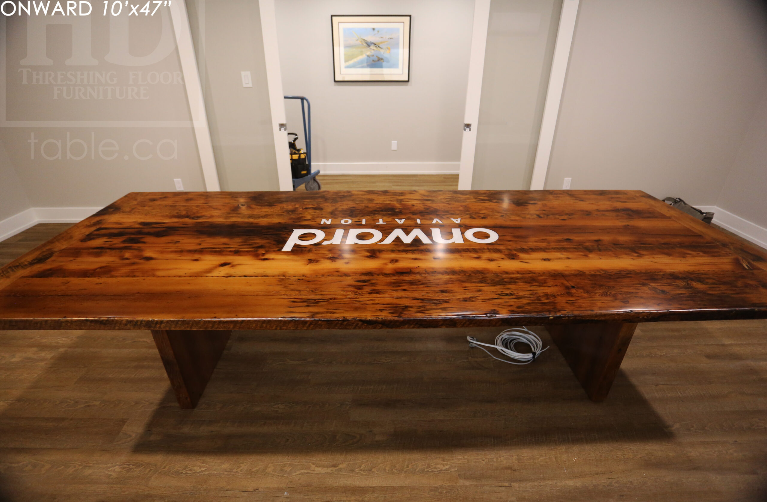 10 ft Reclaimed Wood Boardroom Table - 47" wide - Reclaimed Hemlock Threshing Floor Construction - Original edges & distressing maintained - Modern Plank style base - Custom metal logo routered into top - Premium epoxy + satin polyurethane finish / www.table.ca