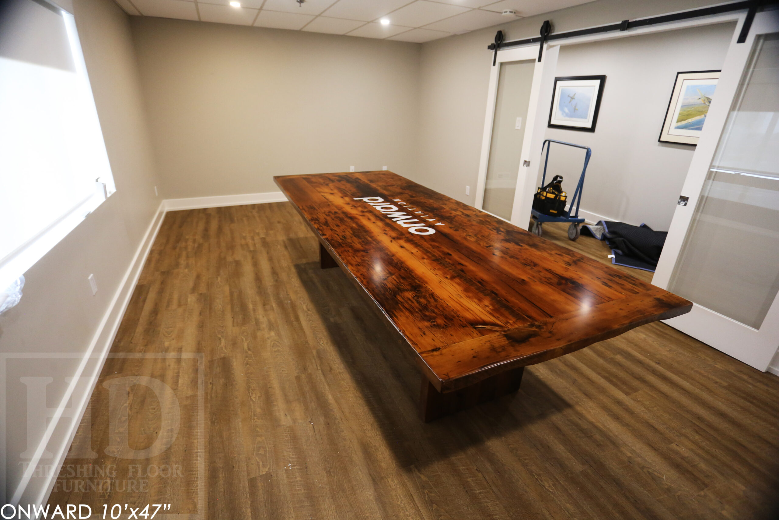 10 ft Reclaimed Wood Boardroom Table - 47" wide - Reclaimed Hemlock Threshing Floor Construction - Original edges & distressing maintained - Modern Plank style base - Custom metal logo routered into top - Premium epoxy + satin polyurethane finish / www.table.ca