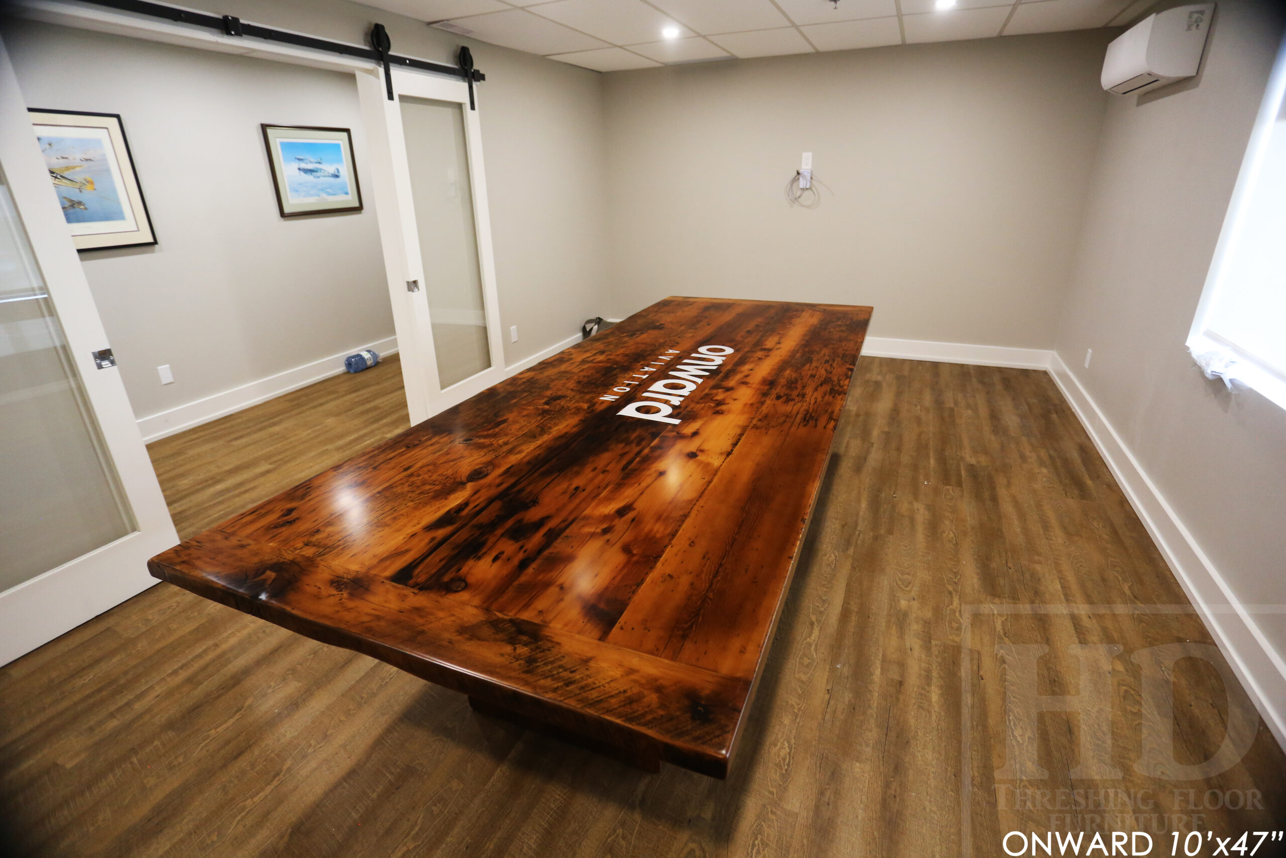 10 ft Reclaimed Wood Boardroom Table - 47" wide - Reclaimed Hemlock Threshing Floor Construction - Original edges & distressing maintained - Modern Plank style base - Custom metal logo routered into top - Premium epoxy + satin polyurethane finish / www.table.ca