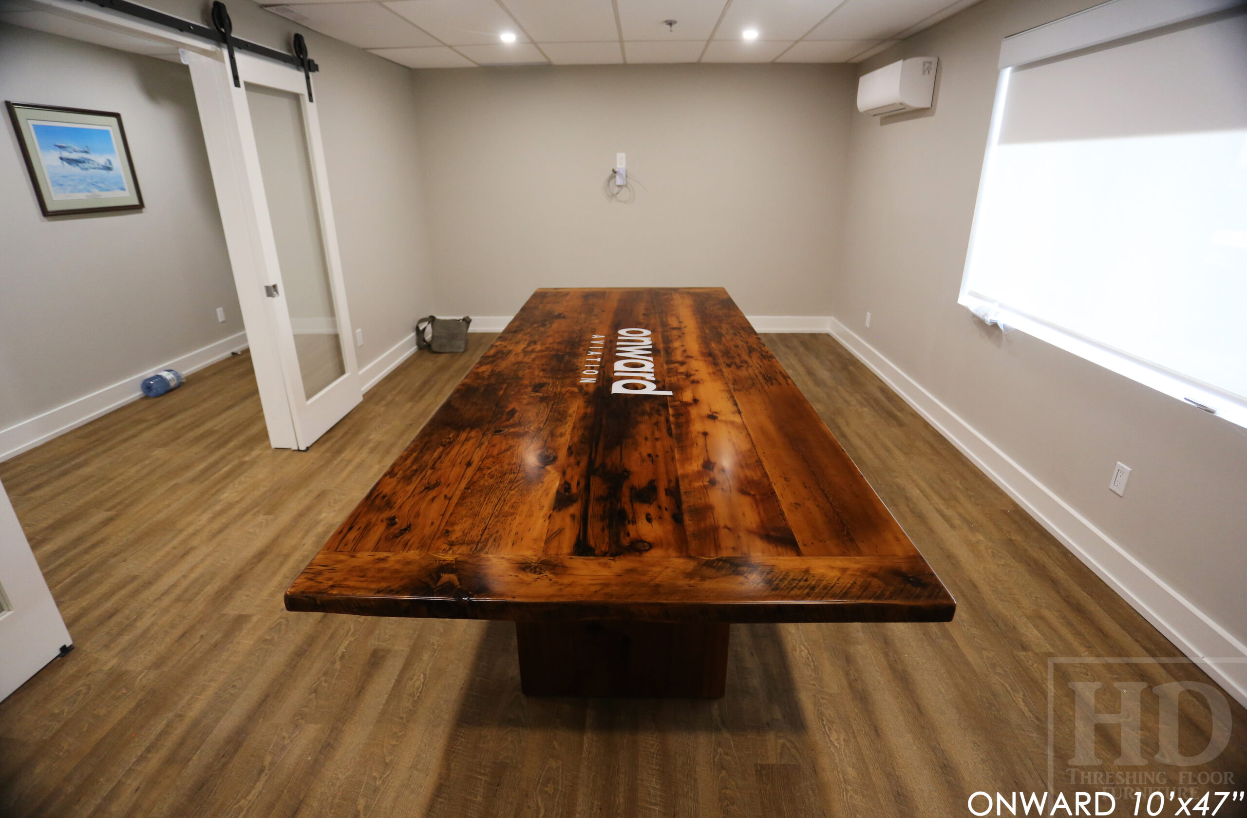 10 ft Reclaimed Wood Boardroom Table - 47" wide - Reclaimed Hemlock Threshing Floor Construction - Original edges & distressing maintained - Modern Plank style base - Custom metal logo routered into top - Premium epoxy + satin polyurethane finish / www.table.ca