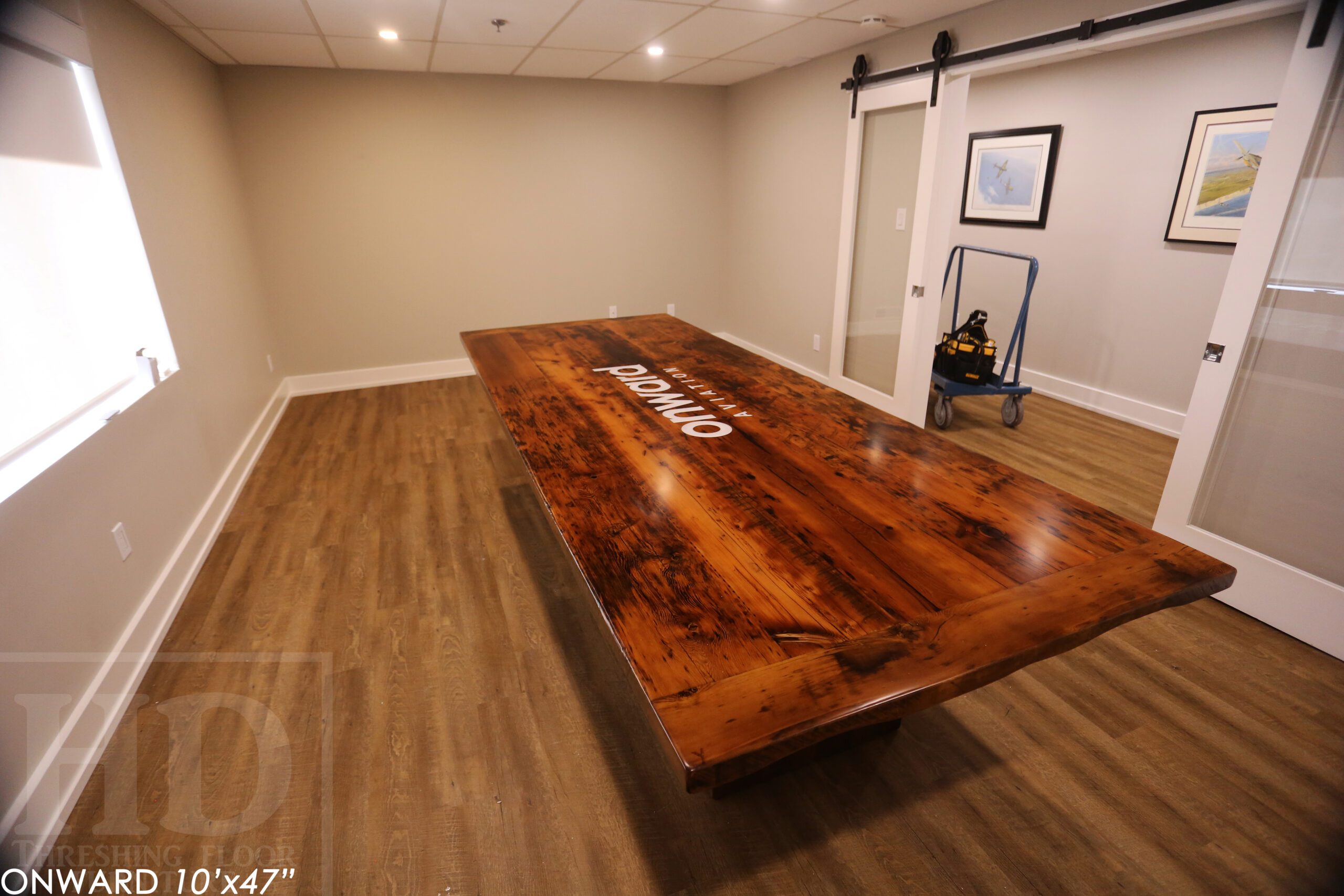 10 ft Reclaimed Wood Boardroom Table - 47" wide - Reclaimed Hemlock Threshing Floor Construction - Original edges & distressing maintained - Modern Plank style base - Custom metal logo routered into top - Premium epoxy + satin polyurethane finish / www.table.ca