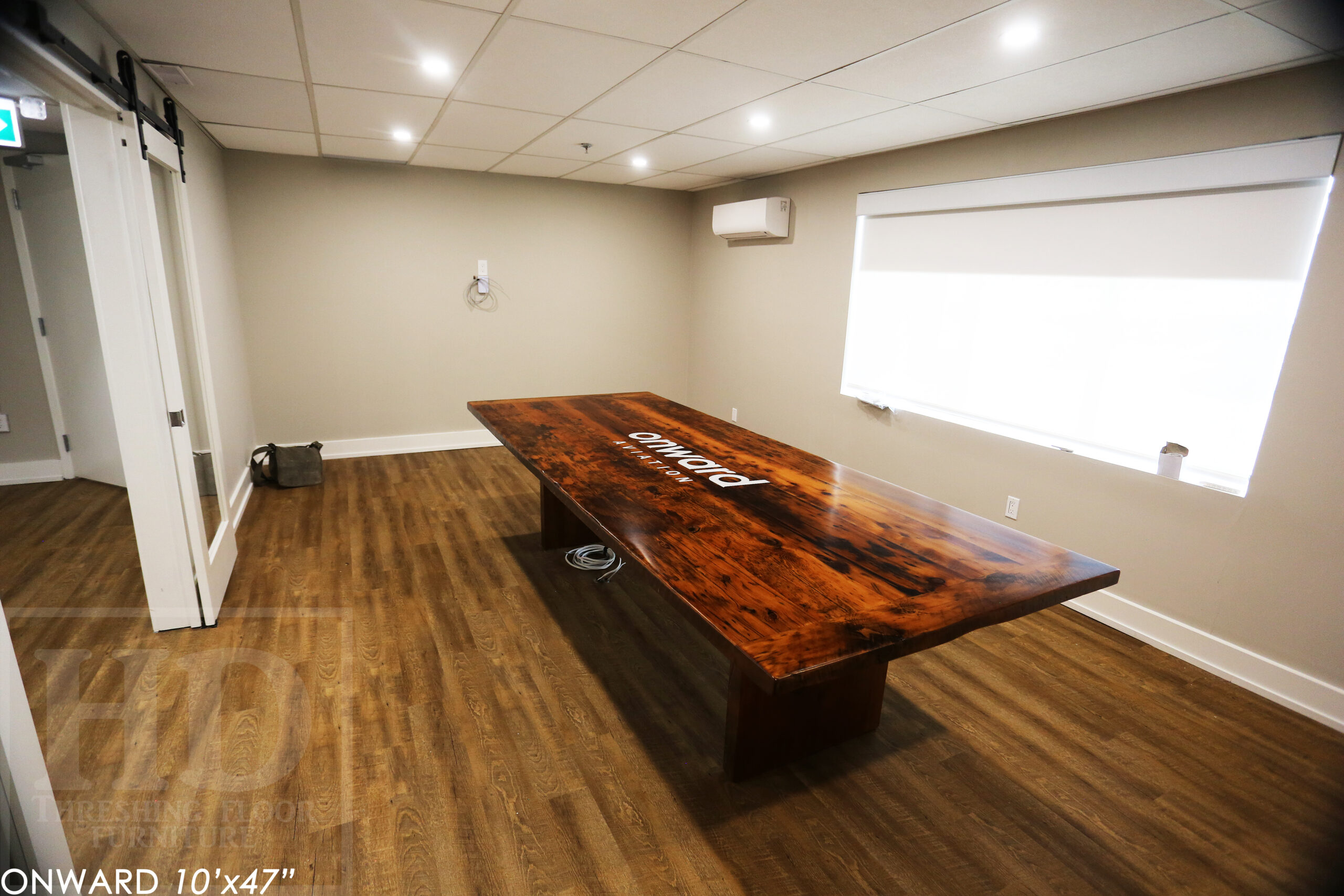 10 ft Reclaimed Wood Boardroom Table - 47" wide - Reclaimed Hemlock Threshing Floor Construction - Original edges & distressing maintained - Modern Plank style base - Custom metal logo routered into top - Premium epoxy + satin polyurethane finish / www.table.ca