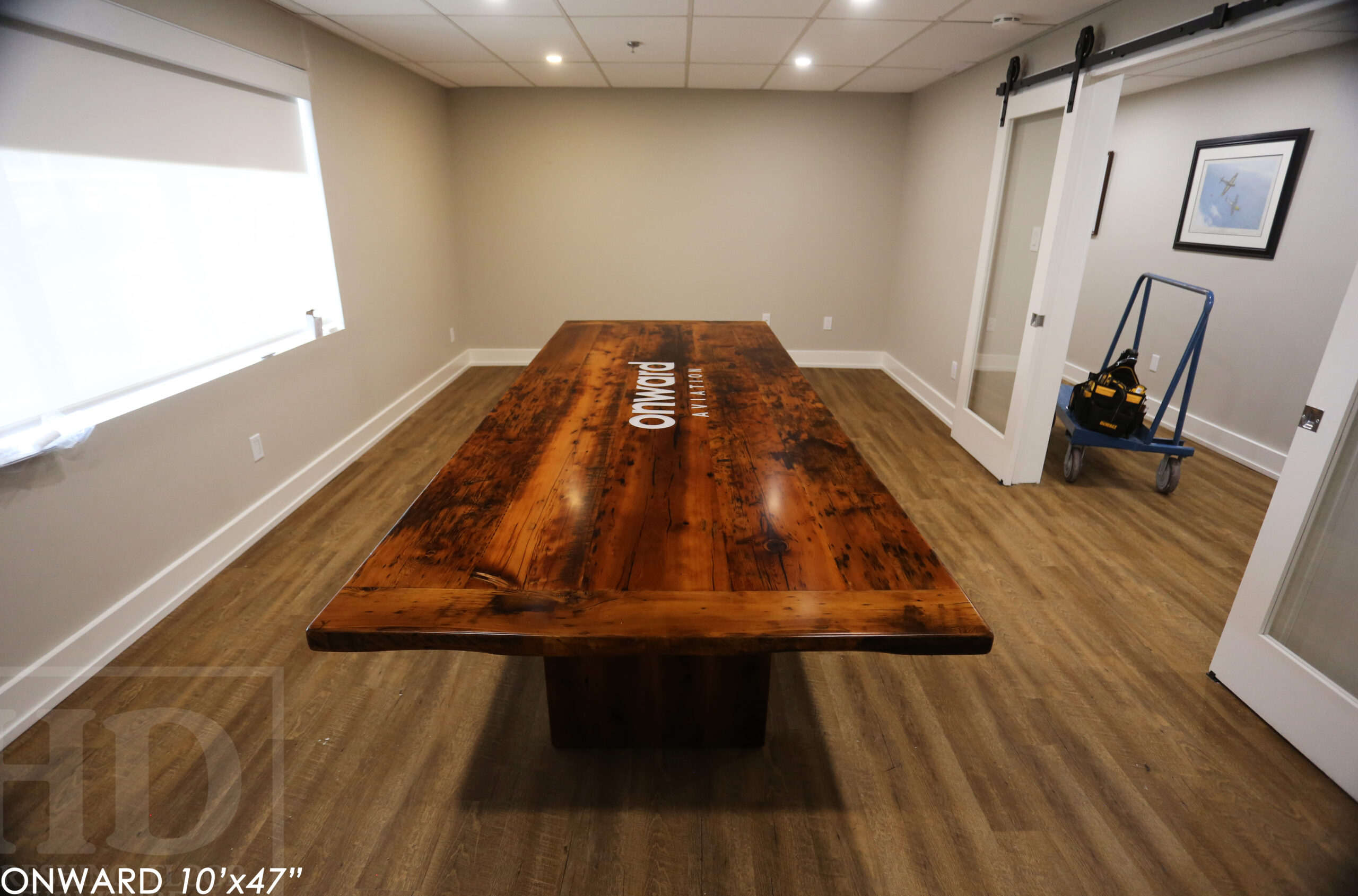 10 ft Reclaimed Wood Boardroom Table - 47" wide - Reclaimed Hemlock Threshing Floor Construction - Original edges & distressing maintained - Modern Plank style base - Custom metal logo routered into top - Premium epoxy + satin polyurethane finish / www.table.ca