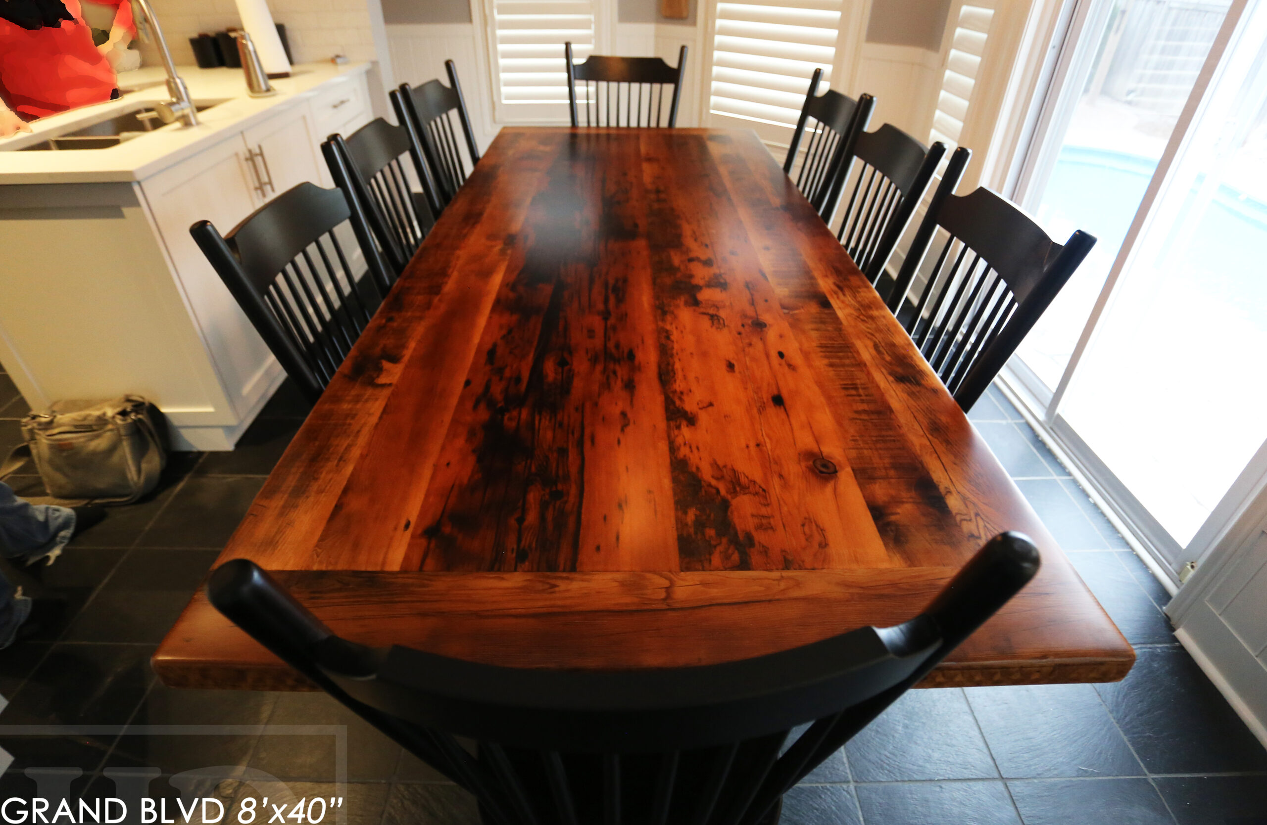 96" Reclaimed Wood Table for an Oakville home - 40" wide - Hemlock Threshing Floor Barnwood Construction - Original edges & distressing maintained - Matte Black Metal Base - Premium epoxy + satin polyurethane finish - 8 Buckhorn Chairs / Wormy Maple / Solid Black Painted / satin polyurethane finish / www.table.ca