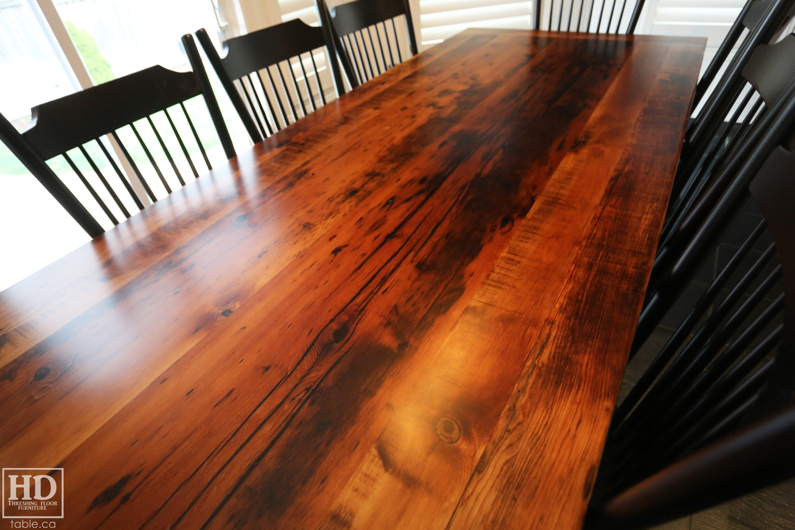 96" Reclaimed Wood Table for an Oakville home - 40" wide - Hemlock Threshing Floor Barnwood Construction - Original edges & distressing maintained - Matte Black Metal Base - Premium epoxy + satin polyurethane finish - 8 Buckhorn Chairs / Wormy Maple / Solid Black Painted / satin polyurethane finish / www.table.ca