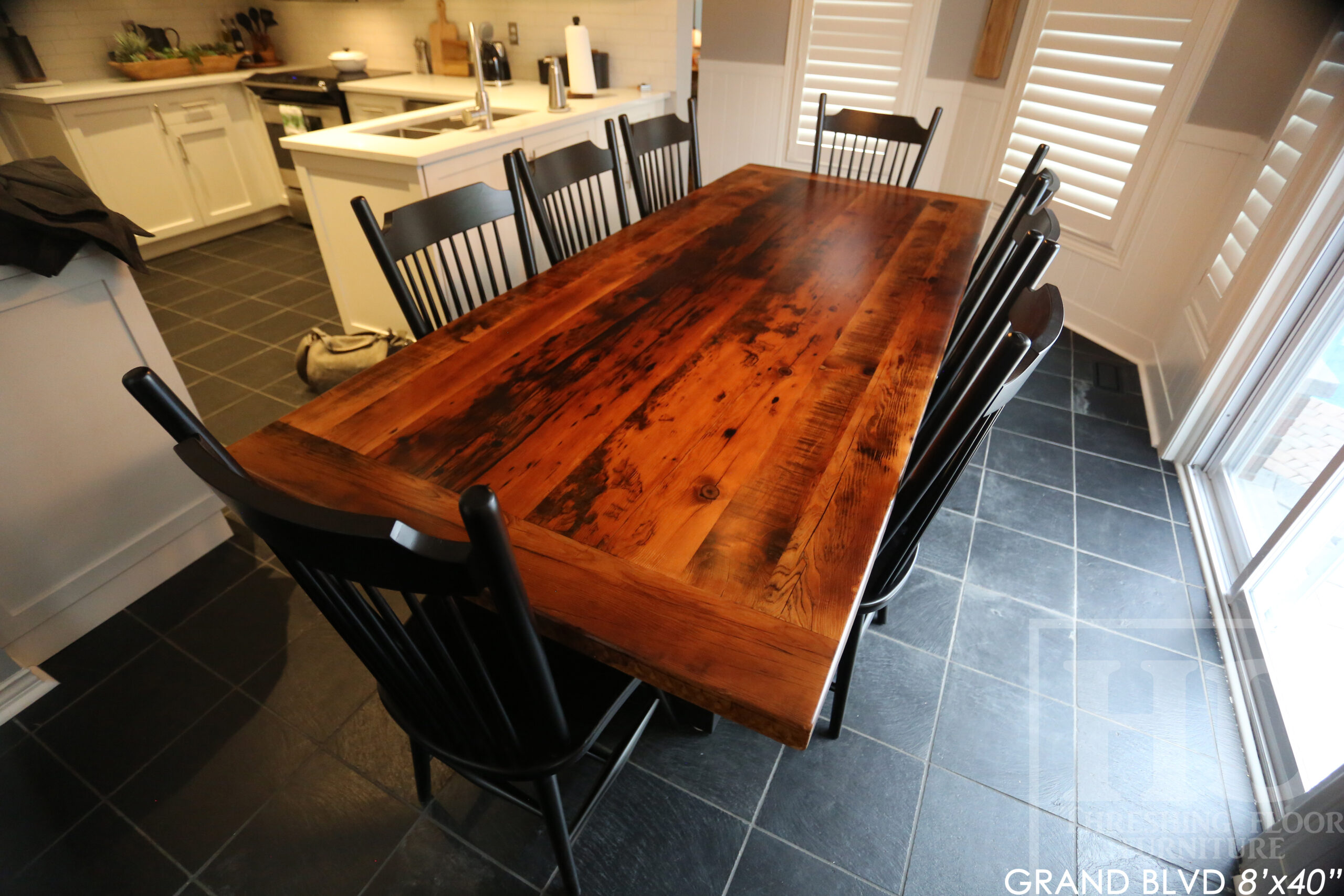 96" Reclaimed Wood Table for an Oakville home - 40" wide - Hemlock Threshing Floor Barnwood Construction - Original edges & distressing maintained - Matte Black Metal Base - Premium epoxy + satin polyurethane finish - 8 Buckhorn Chairs / Wormy Maple / Solid Black Painted / satin polyurethane finish / www.table.ca