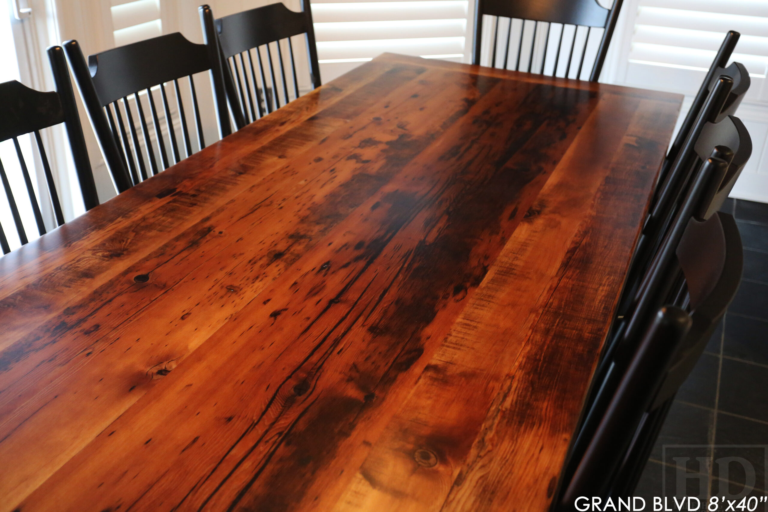 96" Reclaimed Wood Table for an Oakville home - 40" wide - Hemlock Threshing Floor Barnwood Construction - Original edges & distressing maintained - Matte Black Metal Base - Premium epoxy + satin polyurethane finish - 8 Buckhorn Chairs / Wormy Maple / Solid Black Painted / satin polyurethane finish / www.table.ca