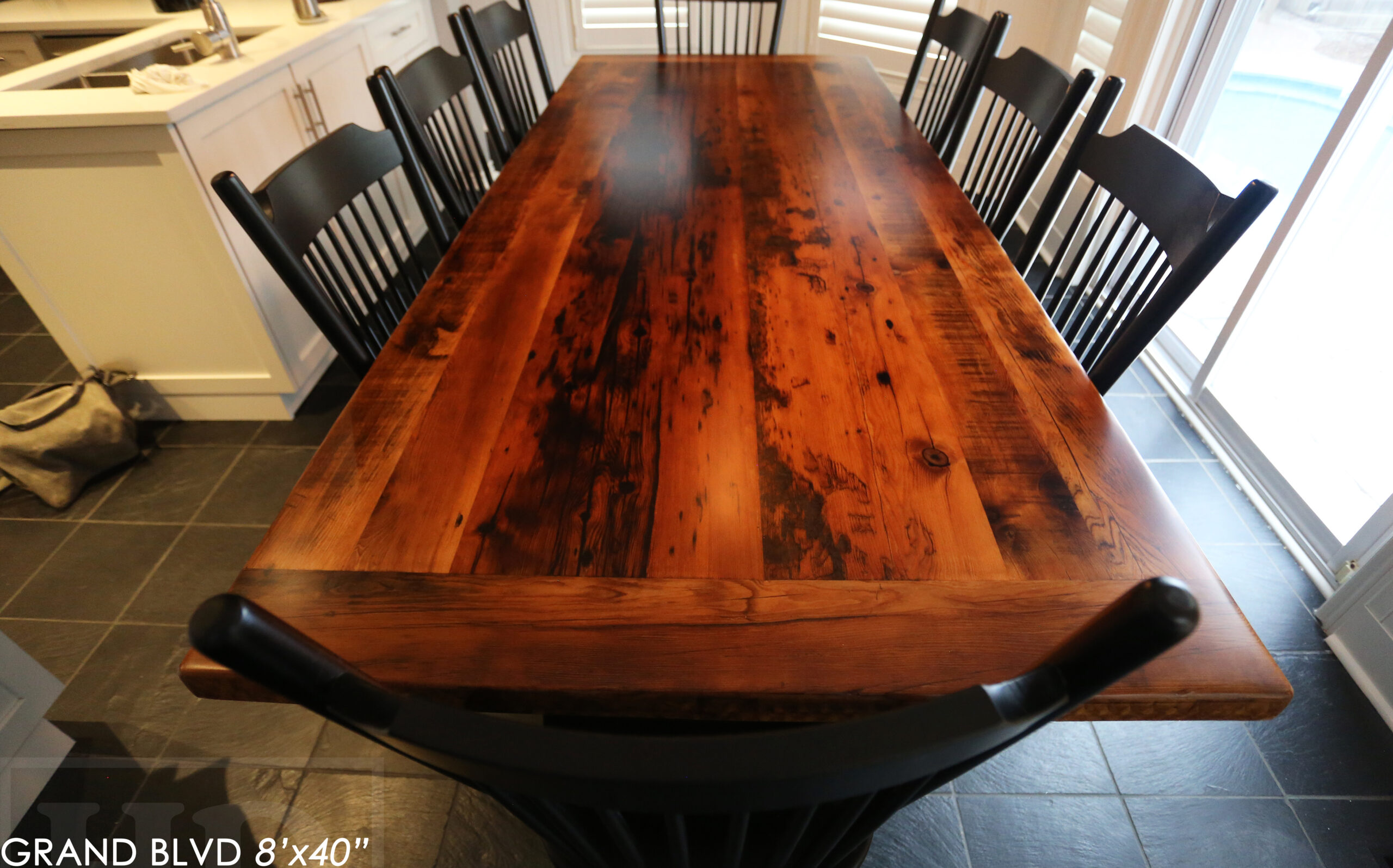 96" Reclaimed Wood Table for an Oakville home - 40" wide - Hemlock Threshing Floor Barnwood Construction - Original edges & distressing maintained - Matte Black Metal Base - Premium epoxy + satin polyurethane finish - 8 Buckhorn Chairs / Wormy Maple / Solid Black Painted / satin polyurethane finish / www.table.ca