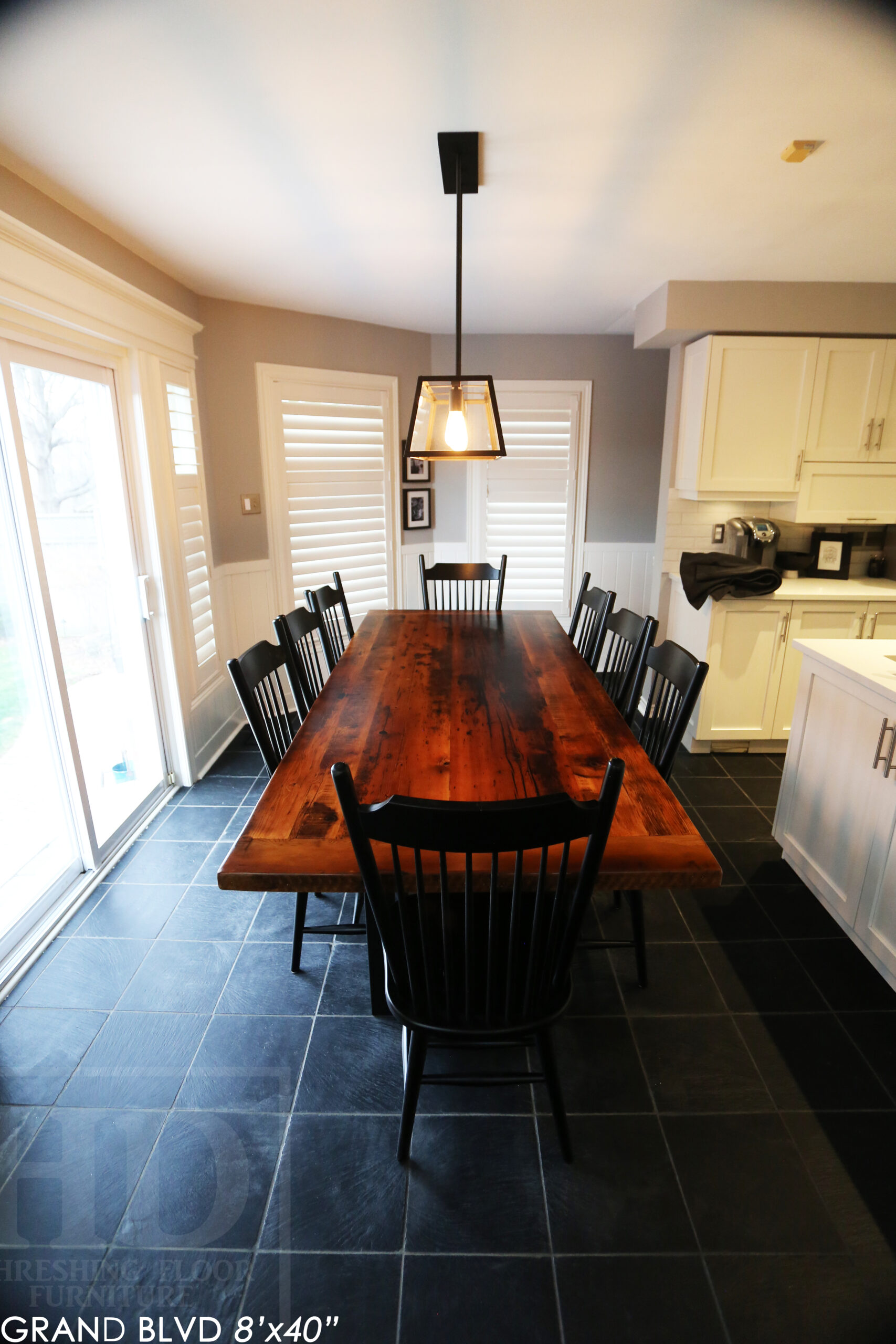 96" Reclaimed Wood Table for an Oakville home - 40" wide - Hemlock Threshing Floor Barnwood Construction - Original edges & distressing maintained - Matte Black Metal Base - Premium epoxy + satin polyurethane finish - 8 Buckhorn Chairs / Wormy Maple / Solid Black Painted / satin polyurethane finish / www.table.ca