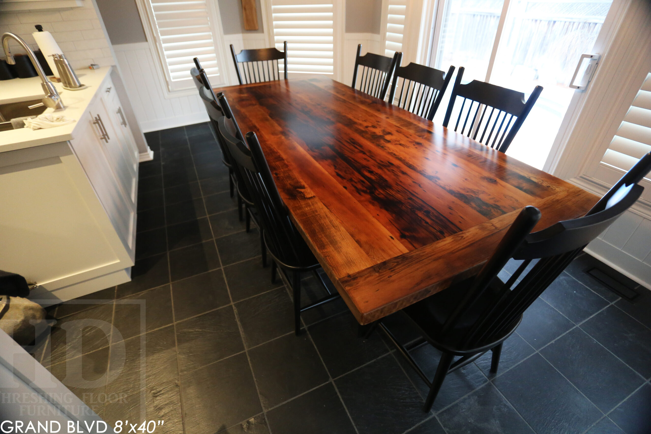 96" Reclaimed Wood Table for an Oakville home - 40" wide - Hemlock Threshing Floor Barnwood Construction - Original edges & distressing maintained - Matte Black Metal Base - Premium epoxy + satin polyurethane finish - 8 Buckhorn Chairs / Wormy Maple / Solid Black Painted / satin polyurethane finish / www.table.ca