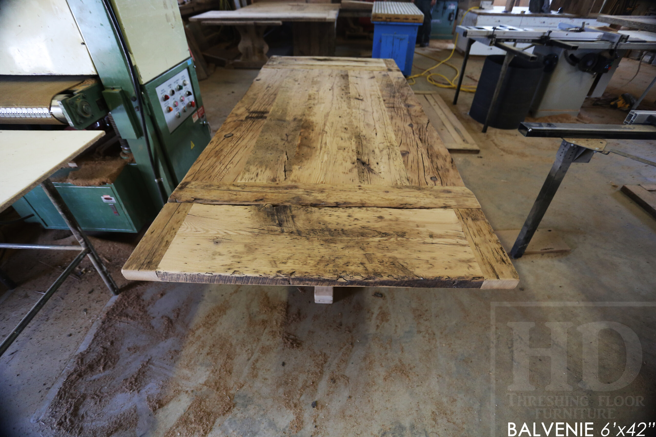 6' Reclaimed Wood Table for a Caledonia Home - 42" wide - Hand-Hewn Beam Pedestals Base - Hemlock Threshing Floor Construction - Original edges & distressing maintained - Premium epoxy + satin polyurethane finish - Two 12" Leaf Extensions - 18" Round Lazy Susan - 6' reclaimed wood bench / www.table.ca