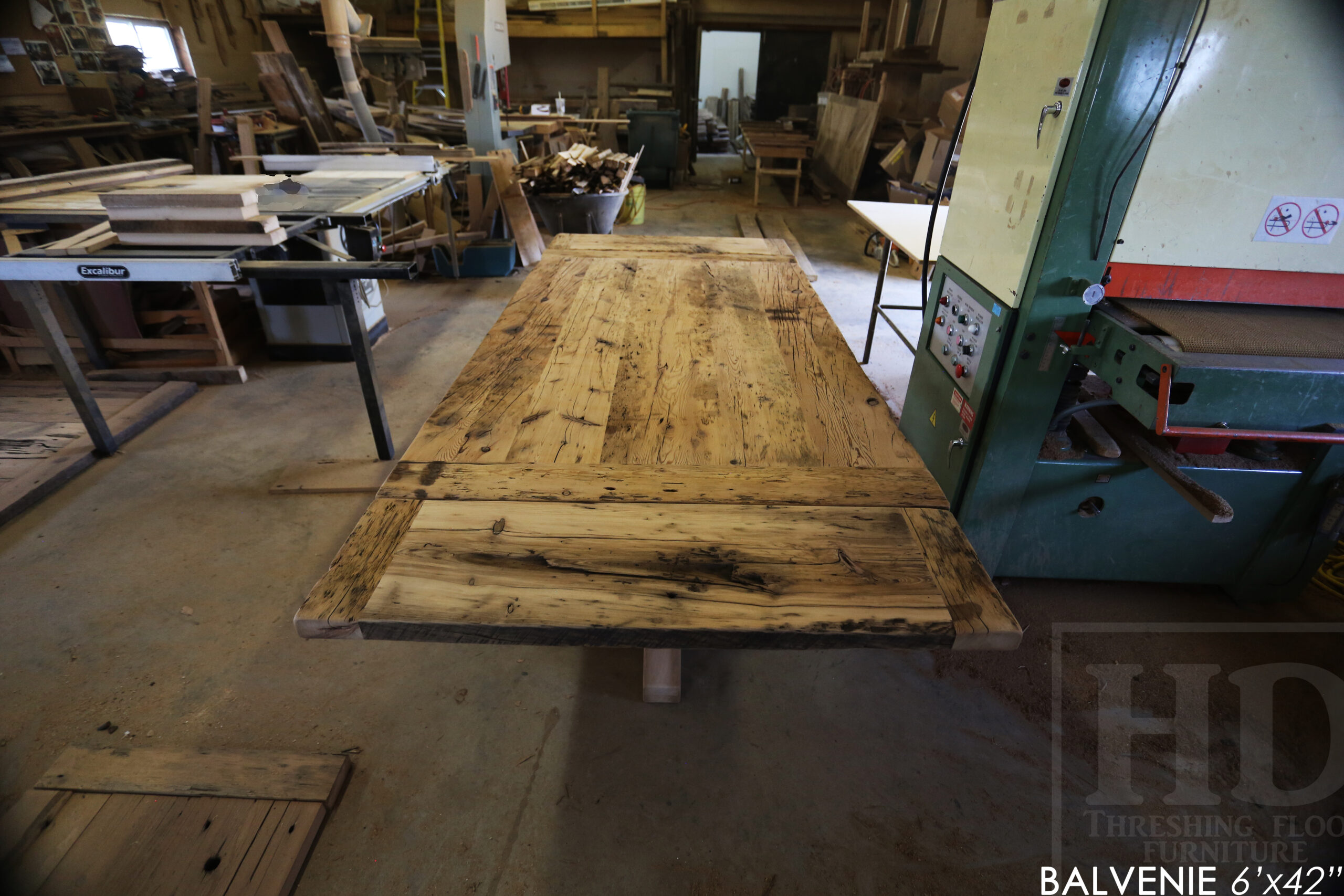 6' Reclaimed Wood Table for a Caledonia Home - 42" wide - Hand-Hewn Beam Pedestals Base - Hemlock Threshing Floor Construction - Original edges & distressing maintained - Premium epoxy + satin polyurethane finish - Two 12" Leaf Extensions - 18" Round Lazy Susan - 6' reclaimed wood bench / www.table.ca