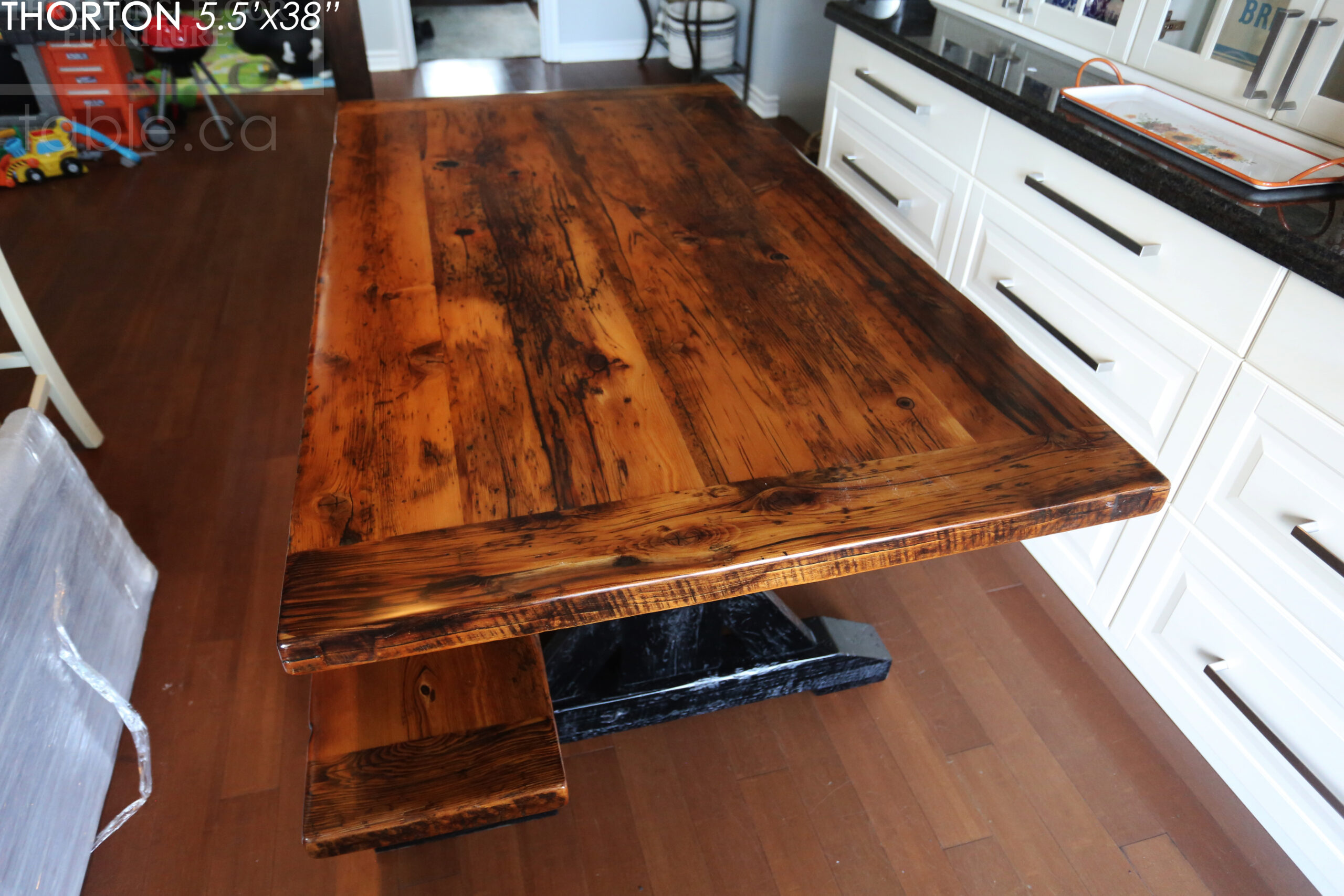 5.5' Reclaimed Wood Table we made for an Ontario home - 38" wide - Sawbuck Base / Painted Black - Old Growth Hemlock Threshing Floor Construction - Original edges & distressing maintained - Premium epoxy + satin polyurethane finish - 5' Trestle Bench - www.table.ca