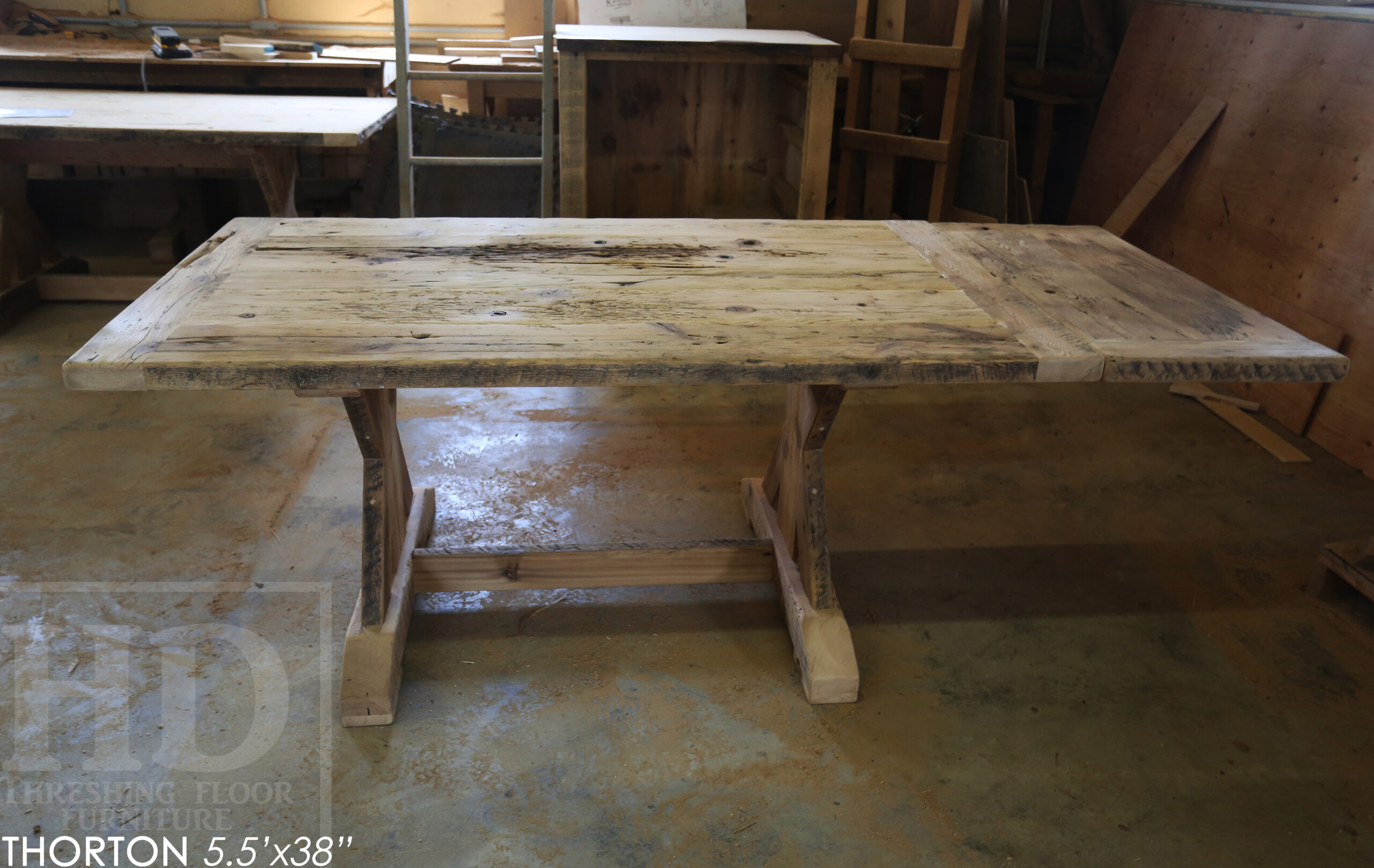 5.5' Reclaimed Wood Table we made for an Ontario home - 38" wide - Sawbuck Base / Painted Black - Old Growth Hemlock Threshing Floor Construction - Original edges & distressing maintained - Premium epoxy + satin polyurethane finish - 5' Trestle Bench - www.table.ca