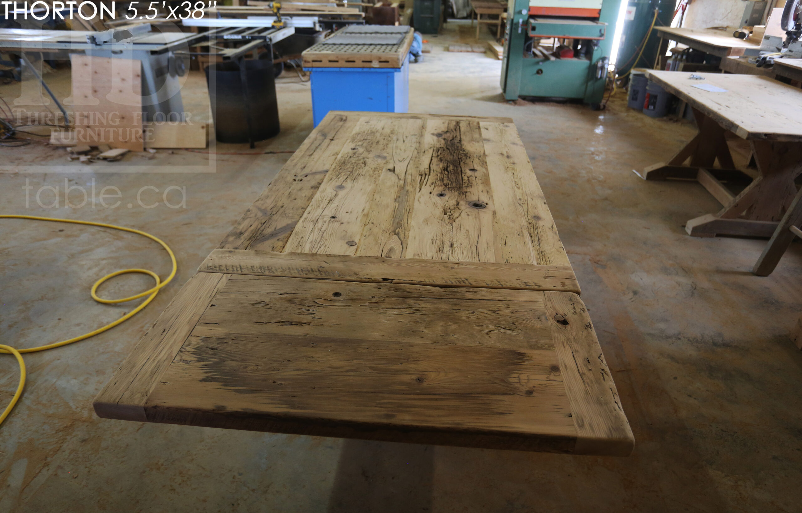 5.5' Reclaimed Wood Table we made for an Ontario home - 38" wide - Sawbuck Base / Painted Black - Old Growth Hemlock Threshing Floor Construction - Original edges & distressing maintained - Premium epoxy + satin polyurethane finish - 5' Trestle Bench - www.table.ca