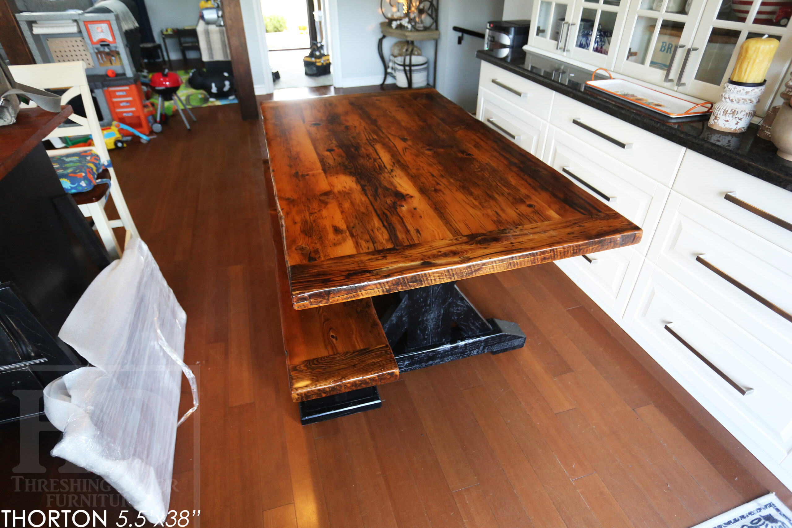 5.5' Reclaimed Wood Table we made for an Ontario home - 38" wide - Sawbuck Base / Painted Black - Old Growth Hemlock Threshing Floor Construction - Original edges & distressing maintained - Premium epoxy + satin polyurethane finish - 5' Trestle Bench - www.table.ca