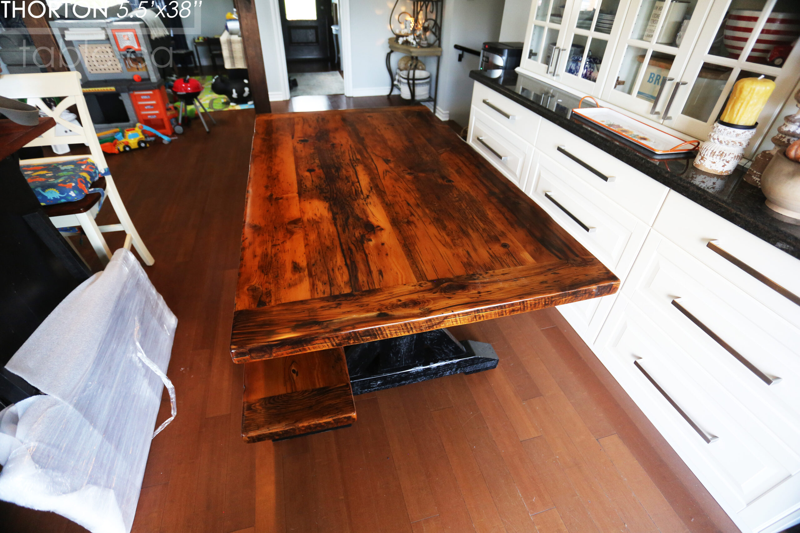 5.5' Reclaimed Wood Table we made for an Ontario home - 38" wide - Sawbuck Base / Painted Black - Old Growth Hemlock Threshing Floor Construction - Original edges & distressing maintained - Premium epoxy + satin polyurethane finish - 5' Trestle Bench - www.table.ca