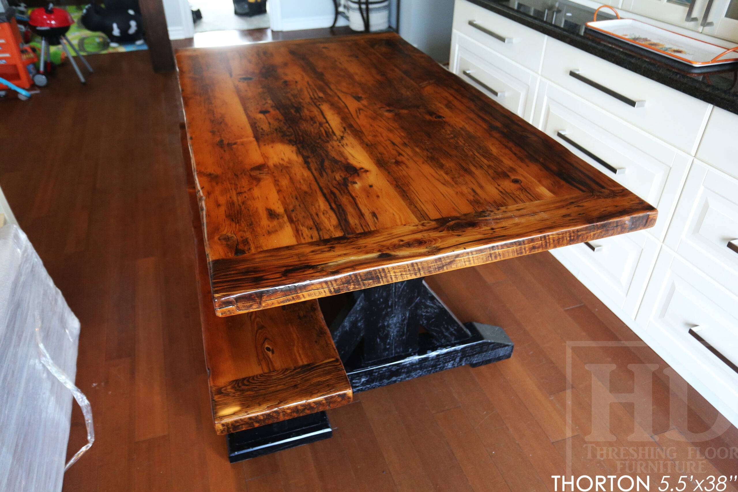 Details: 5.5' Reclaimed Wood Table we made for an Ontario home - 38" wide - Sawbuck Base / Painted Black - Old Growth Hemlock Threshing Floor Construction - Original edges & distressing maintained - Premium epoxy + satin polyurethane finish - 5' Trestle Bench - www.table.ca