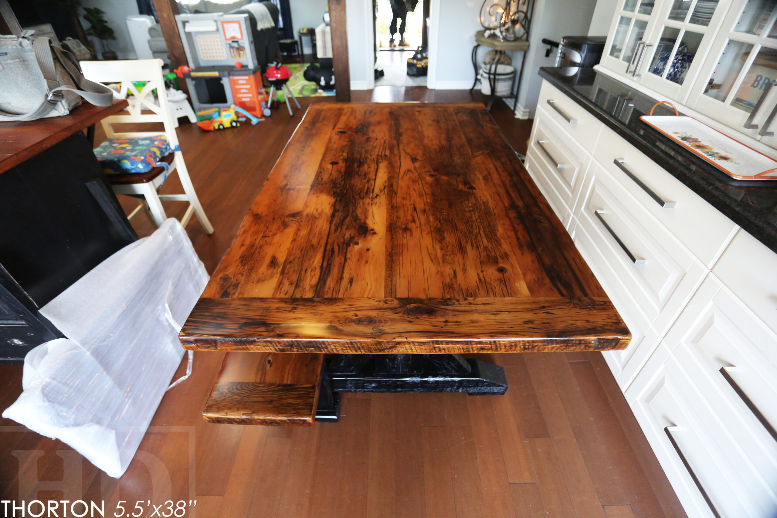 5.5' Reclaimed Wood Table we made for an Ontario home - 38" wide - Sawbuck Base / Painted Black - Old Growth Hemlock Threshing Floor Construction - Original edges & distressing maintained - Premium epoxy + satin polyurethane finish - 5' Trestle Bench - www.table.ca