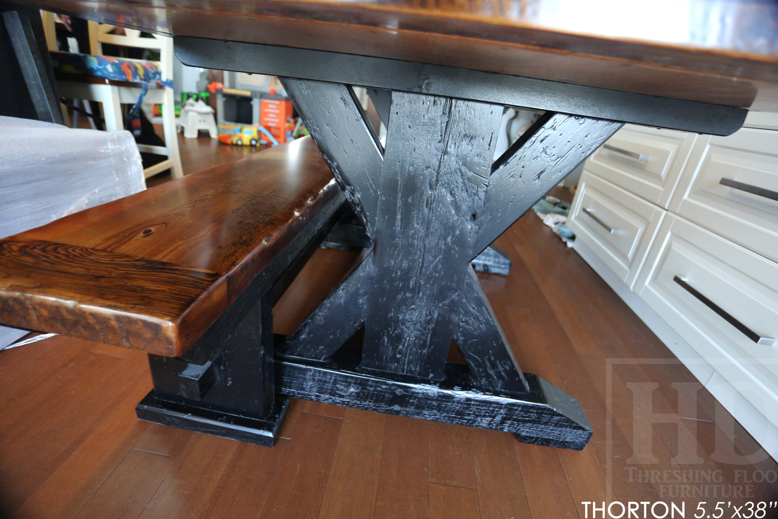 5.5' Reclaimed Wood Table we made for an Ontario home - 38" wide - Sawbuck Base / Painted Black - Old Growth Hemlock Threshing Floor Construction - Original edges & distressing maintained - Premium epoxy + satin polyurethane finish - 5' Trestle Bench - www.table.ca