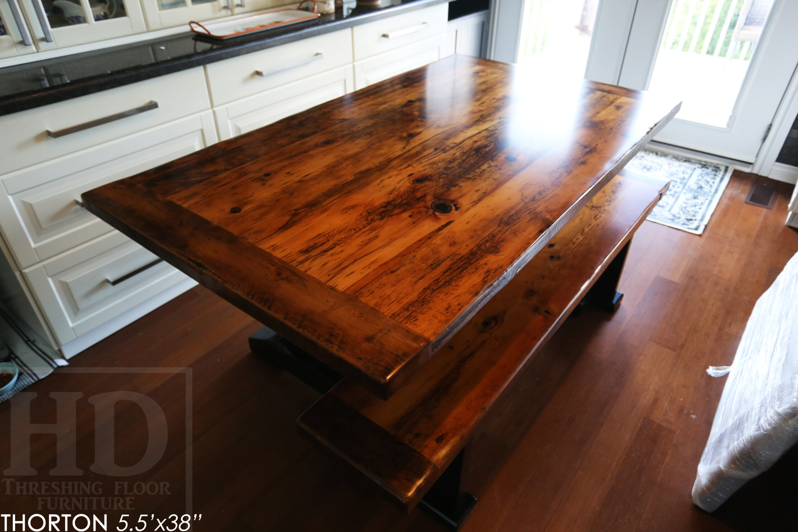 5.5' Reclaimed Wood Table we made for an Ontario home - 38" wide - Sawbuck Base / Painted Black - Old Growth Hemlock Threshing Floor Construction - Original edges & distressing maintained - Premium epoxy + satin polyurethane finish - 5' Trestle Bench - www.table.ca