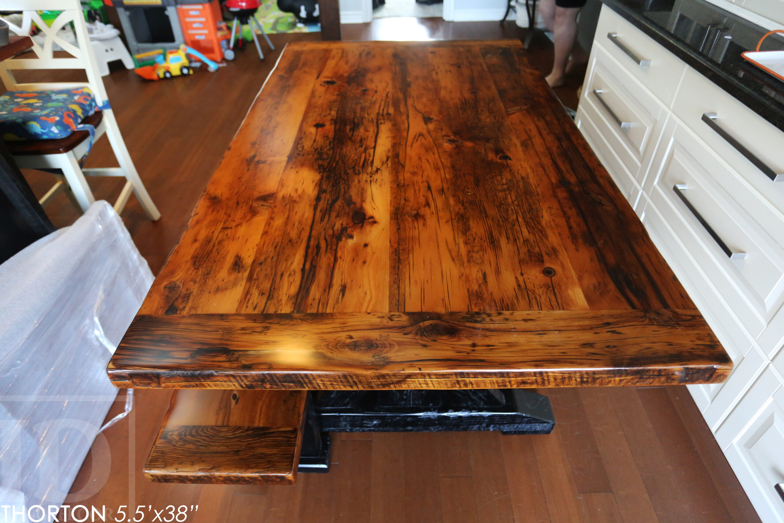 5.5' Reclaimed Wood Table we made for an Ontario home - 38" wide - Sawbuck Base / Painted Black - Old Growth Hemlock Threshing Floor Construction - Original edges & distressing maintained - Premium epoxy + satin polyurethane finish - 5' Trestle Bench - www.table.ca