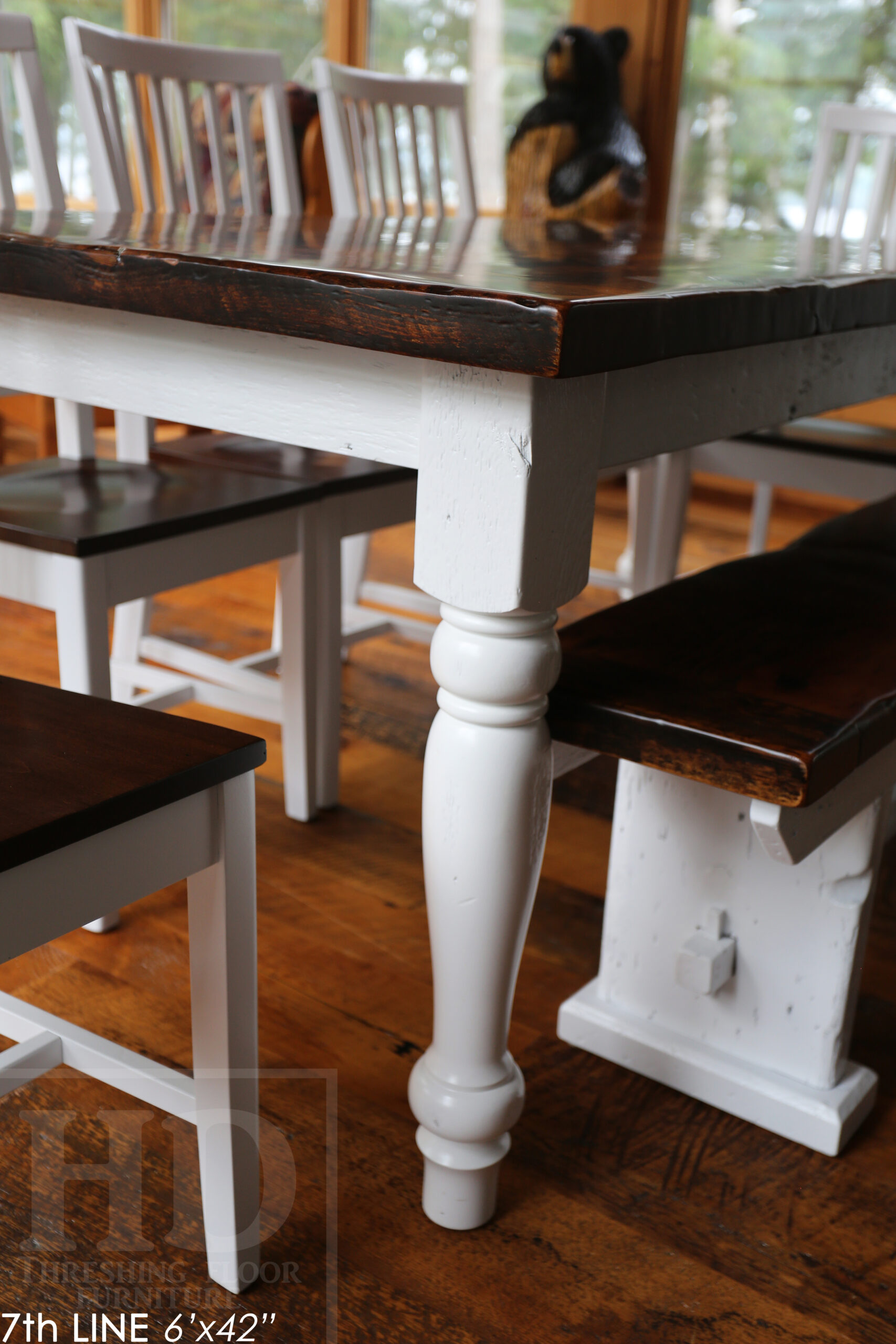 Details: 6' Reclaimed Wood Table we made for an Ontario cottage - 42" wide - Harvest Base - Turned Windbrace Beam Legs [painted white] - Old Growth Hemlock Threshing Floor Construction - Original edges & distressing maintained - Premium epoxy + satin polyurethane finish - 5' Trestle Bench - 5 Hudson Chairs / Wormy Maple / White Frame + Seat stained colour of table - www.table.ca