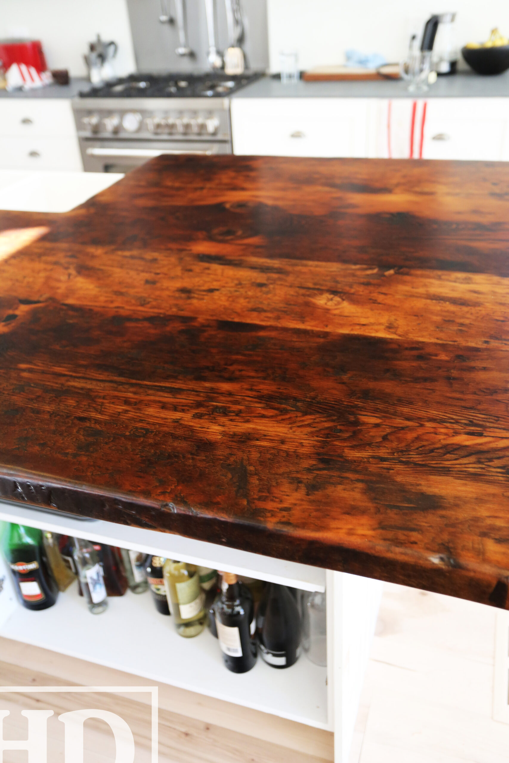 Custom Reclaimed Wood Island Top we made for a Wasaga Beach, Ontario Home - 2" Hemlock Threshing Floor Construction - Original Ontario barnwood edges & distressing maintained - Premium epoxy + satin polyurethane finish - www.table.ca