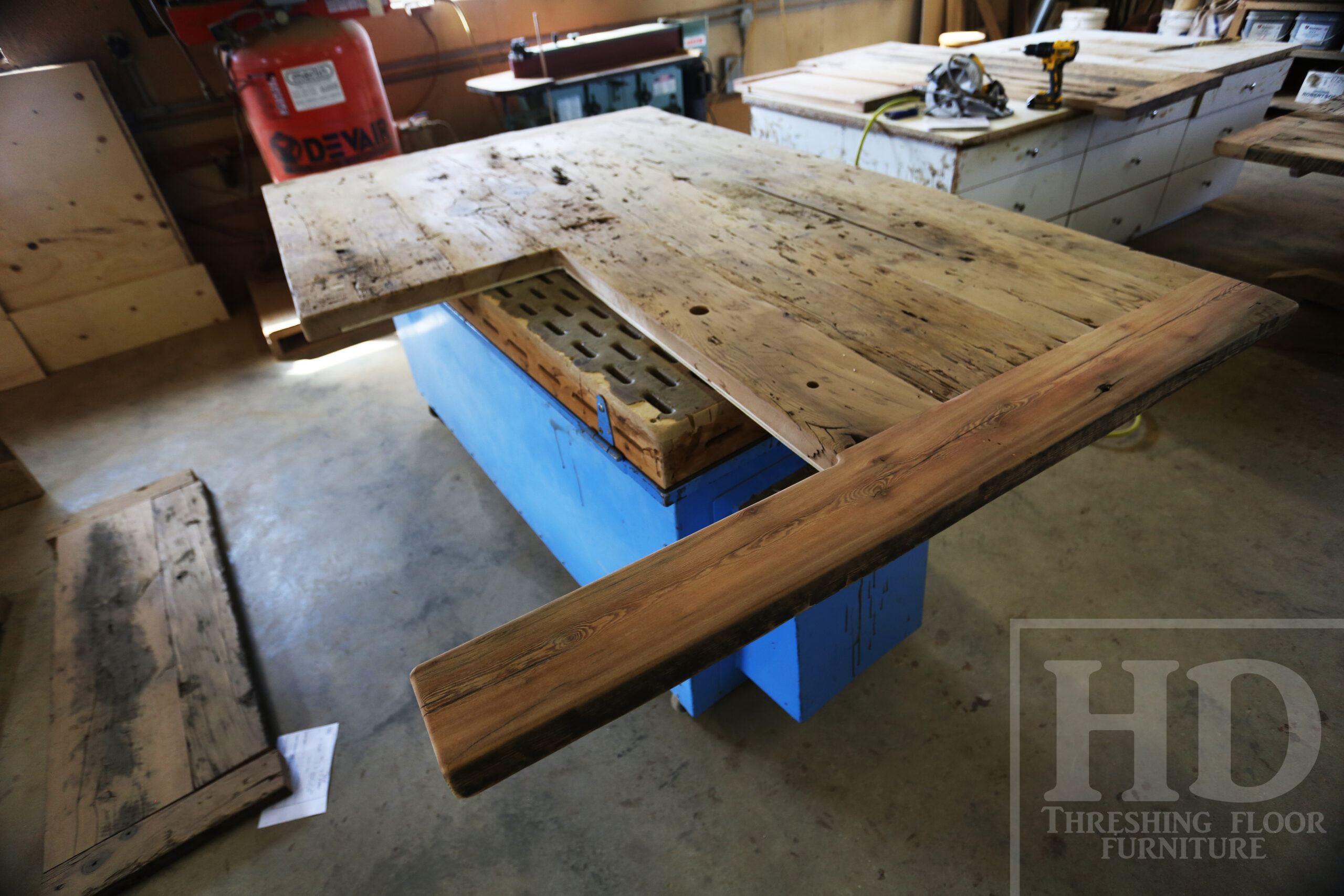 Custom Reclaimed Wood Island Top we made for a Wasaga Beach, Ontario Home - 2" Hemlock Threshing Floor Construction - Original Ontario barnwood edges & distressing maintained - Premium epoxy + satin polyurethane finish - www.table.ca