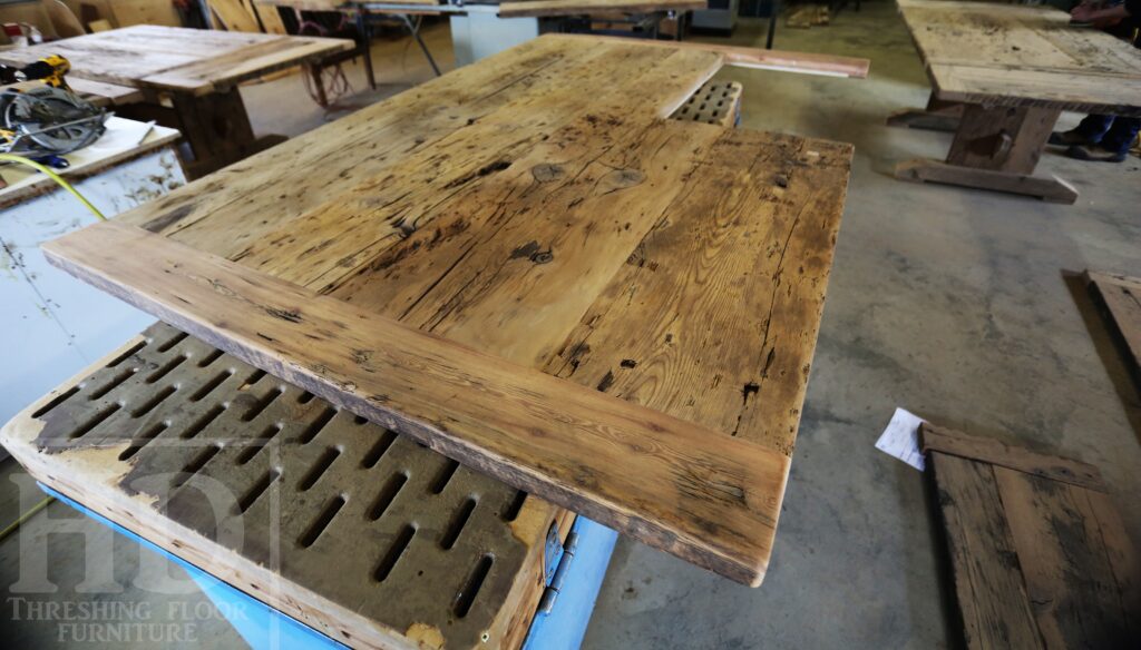 Custom Reclaimed Wood Island Top we made for a Wasaga Beach, Ontario Home - 2" Hemlock Threshing Floor Construction - Original Ontario barnwood edges & distressing maintained - Premium epoxy + satin polyurethane finish - www.table.ca