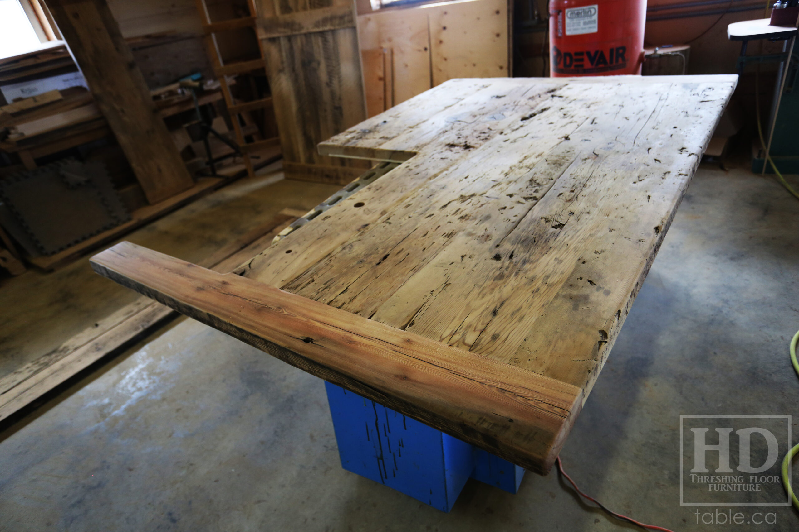 Custom Reclaimed Wood Island Top we made for a Wasaga Beach, Ontario Home - 2" Hemlock Threshing Floor Construction - Original Ontario barnwood edges & distressing maintained - Premium epoxy + satin polyurethane finish - www.table.ca