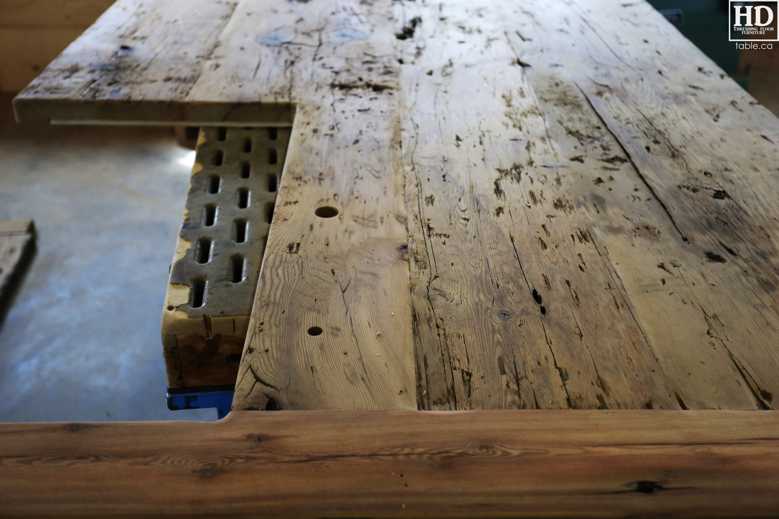 Custom Reclaimed Wood Island Top we made for a Wasaga Beach, Ontario Home - 2" Hemlock Threshing Floor Construction - Original Ontario barnwood edges & distressing maintained - Premium epoxy + satin polyurethane finish - www.table.ca