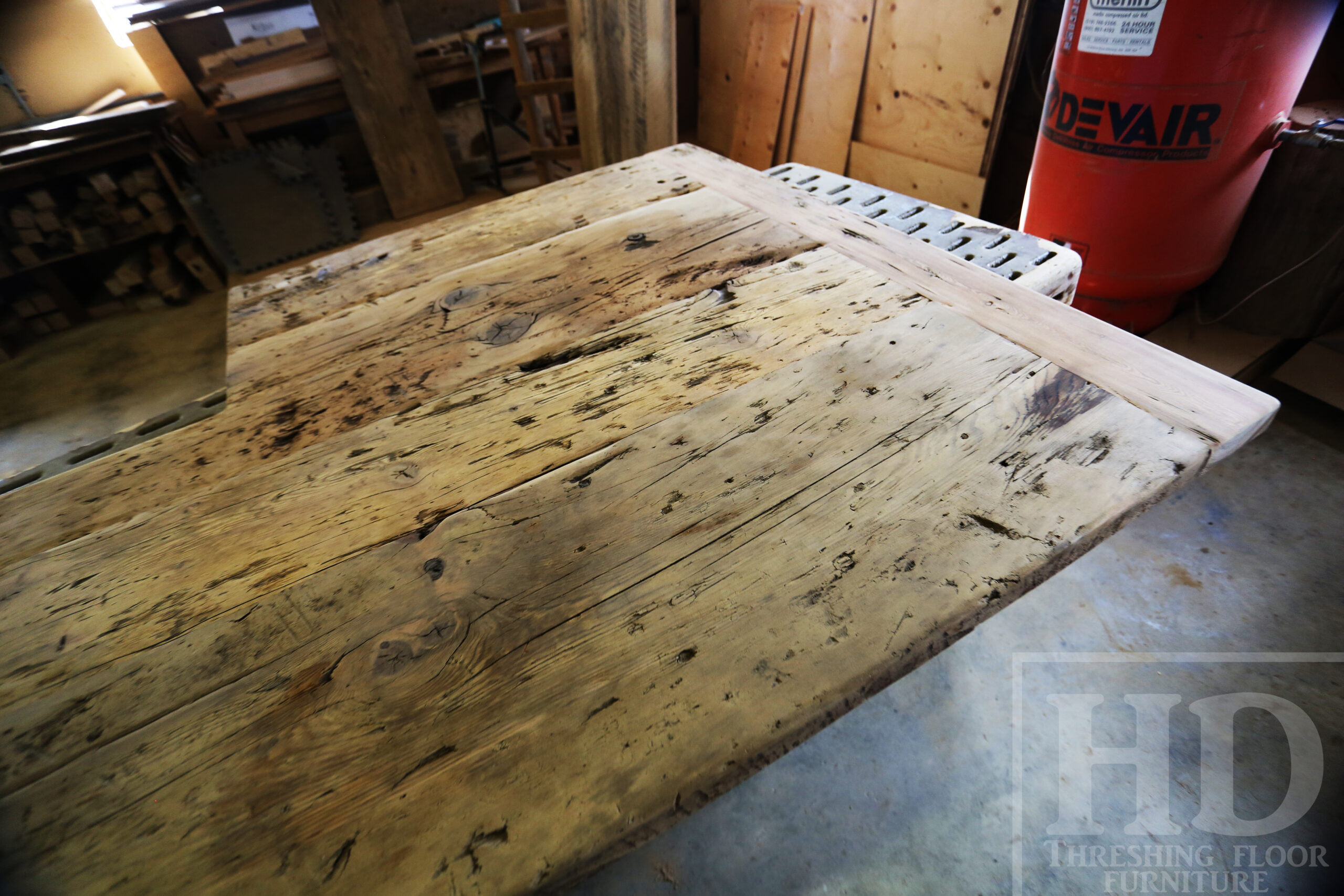 Custom Reclaimed Wood Island Top we made for a Wasaga Beach, Ontario Home - 2" Hemlock Threshing Floor Construction - Original Ontario barnwood edges & distressing maintained - Premium epoxy + satin polyurethane finish - www.table.ca