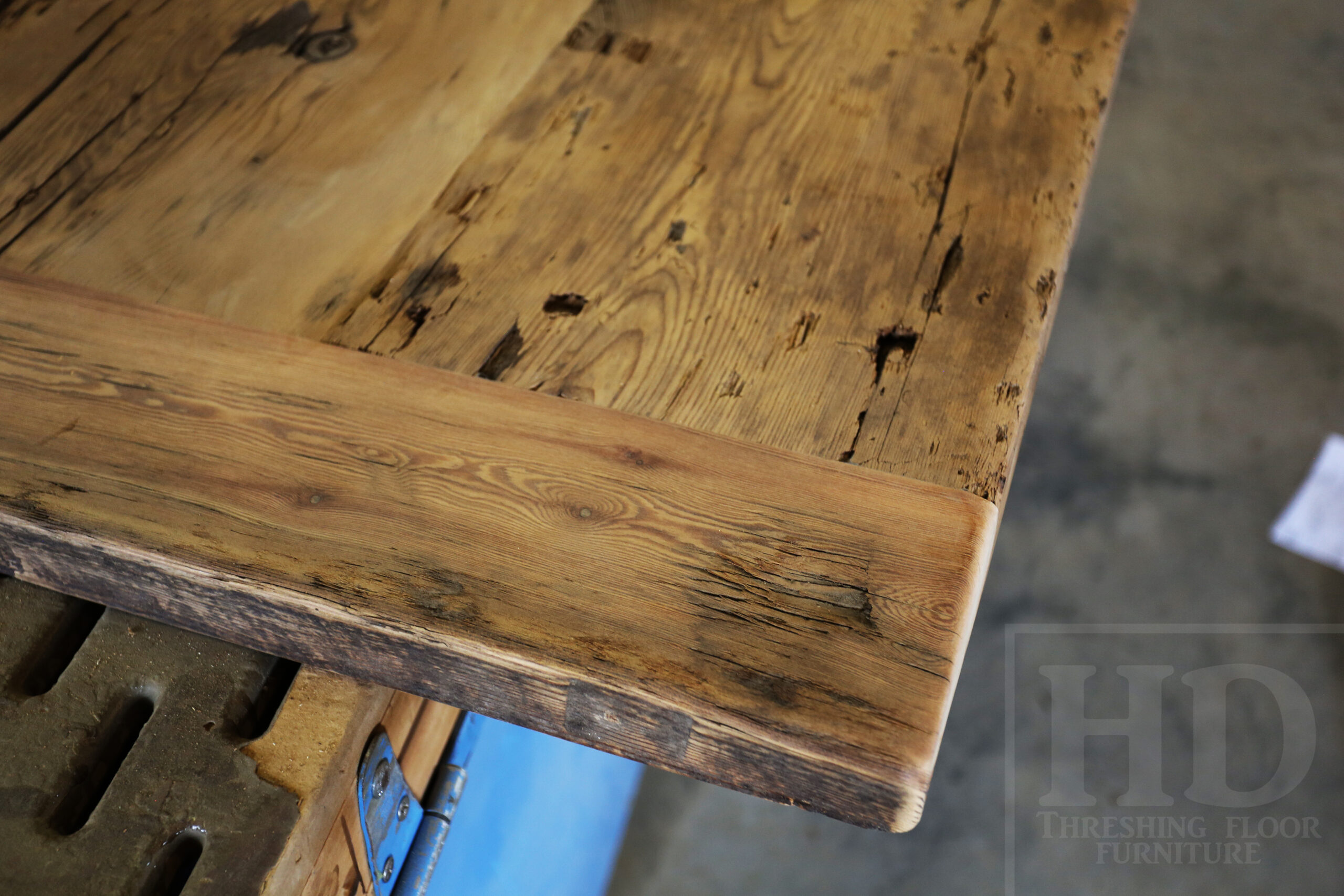 Custom Reclaimed Wood Island Top we made for a Wasaga Beach, Ontario Home - 2" Hemlock Threshing Floor Construction - Original Ontario barnwood edges & distressing maintained - Premium epoxy + satin polyurethane finish - www.table.ca