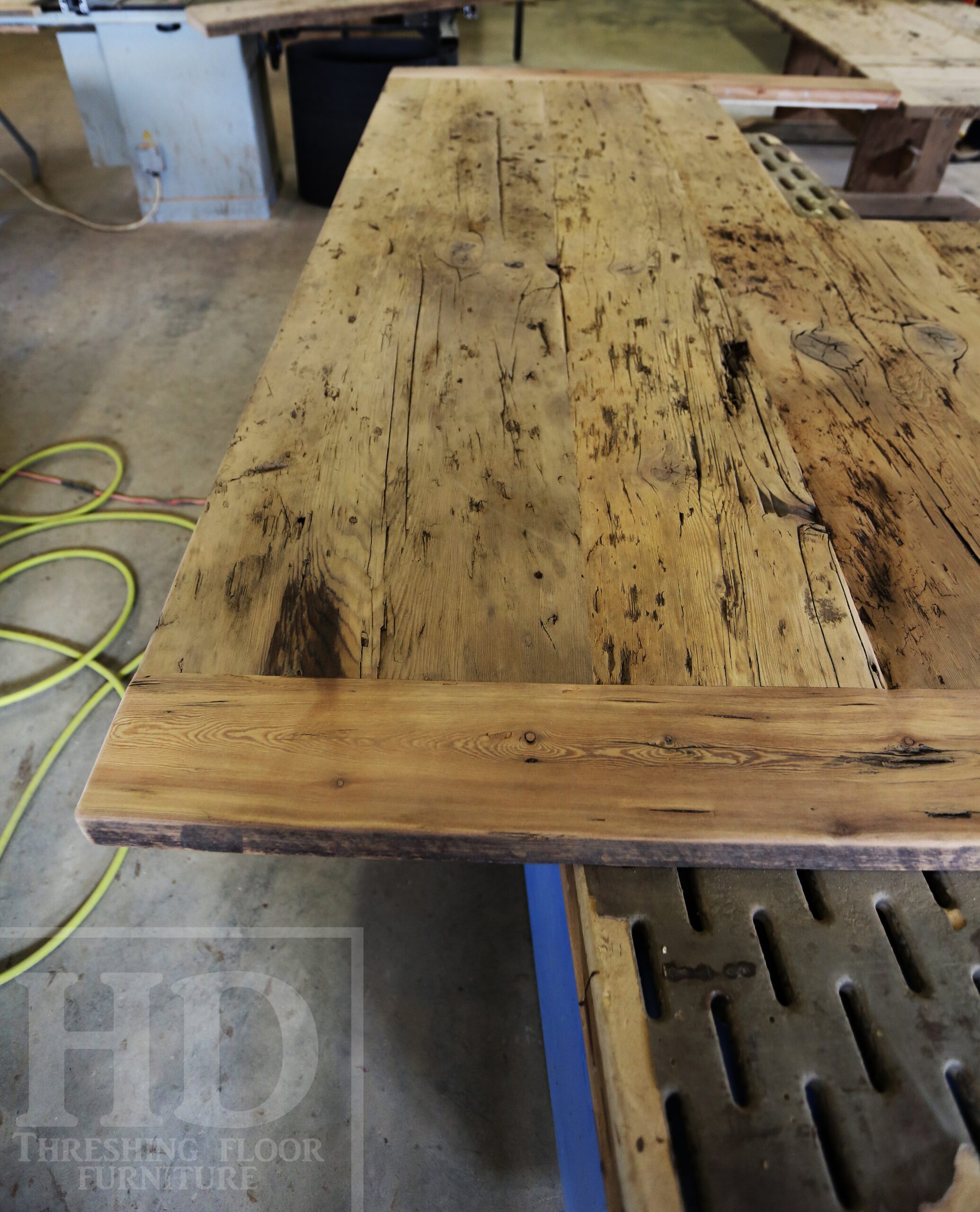 Custom Reclaimed Wood Island Top we made for a Wasaga Beach, Ontario Home - 2" Hemlock Threshing Floor Construction - Original Ontario barnwood edges & distressing maintained - Premium epoxy + satin polyurethane finish - www.table.ca