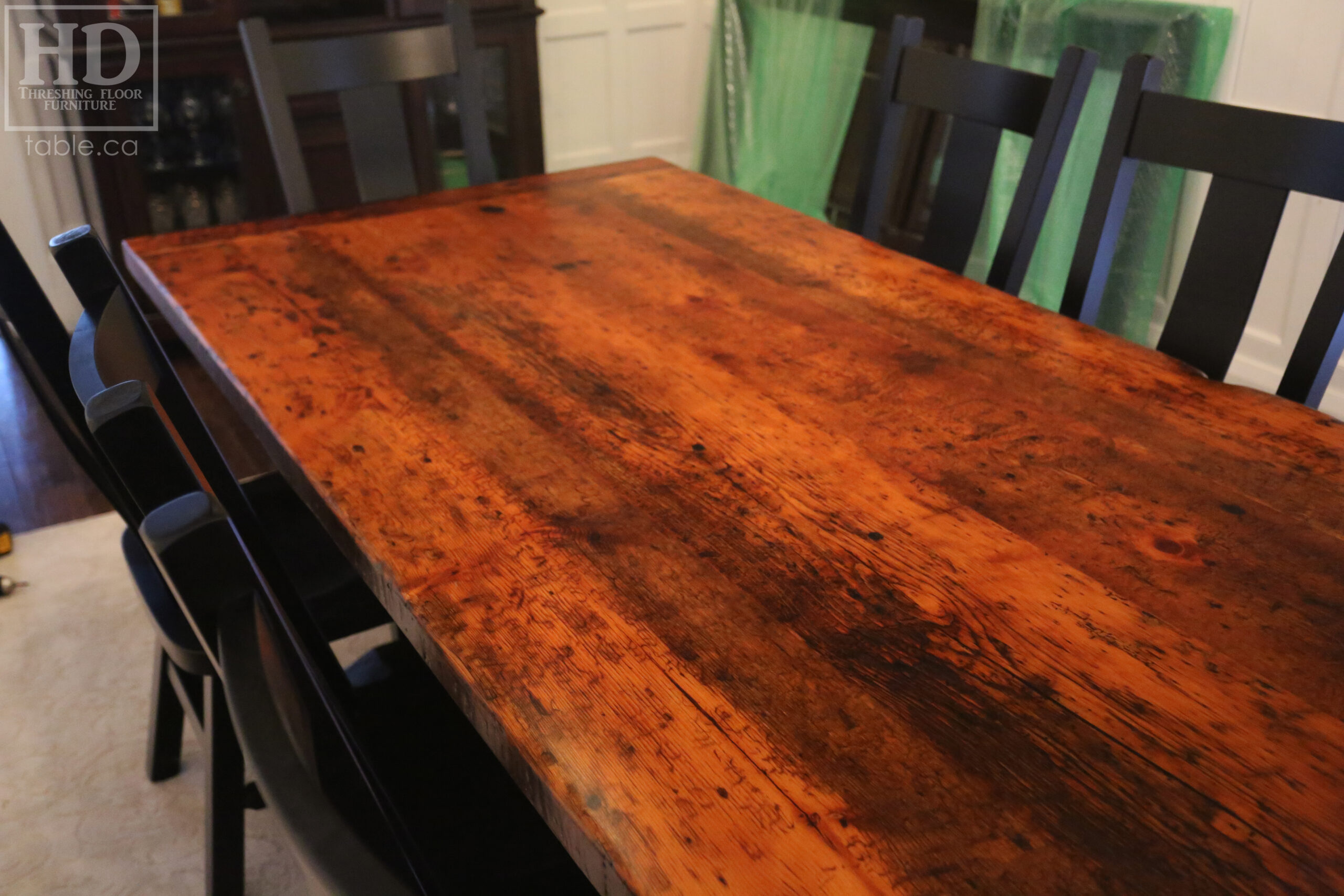 12' Reclaimed Wood Table for a Port Dover home - 42" wide - Trestle Base - 2" Old Growth Pine Threshing Floor Construction - Original edges & distressing maintained - Premium epoxy + satin polyurethane finish - Black Painted Base - 12 Plank Back Chairs / Wormy Maple - Painted Solid Black / Satin polyurethane clearcoat finish - www.table.ca