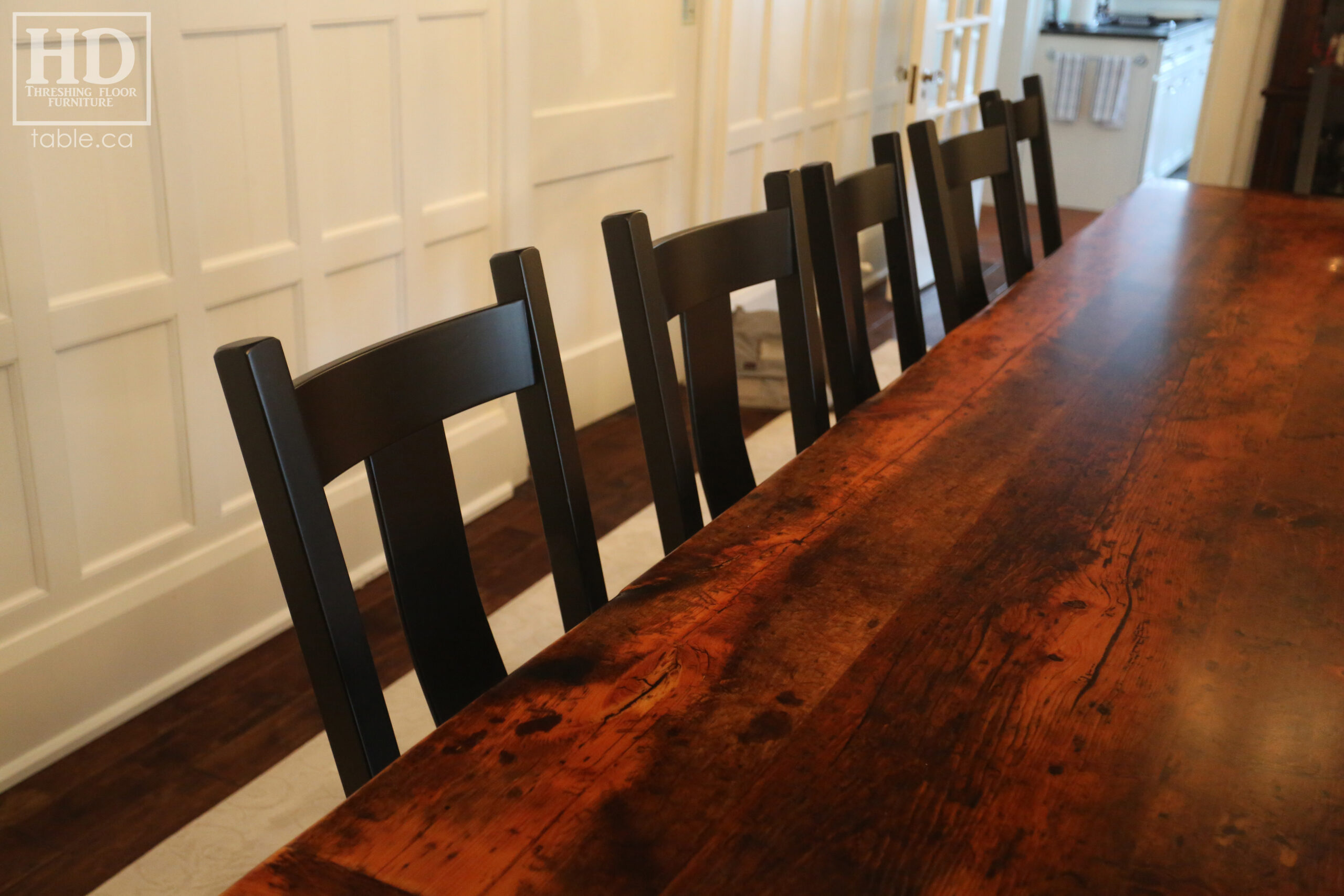 12' Reclaimed Wood Table for a Port Dover home - 42" wide - Trestle Base - 2" Old Growth Pine Threshing Floor Construction - Original edges & distressing maintained - Premium epoxy + satin polyurethane finish - Black Painted Base - 12 Plank Back Chairs / Wormy Maple - Painted Solid Black / Satin polyurethane clearcoat finish - www.table.ca