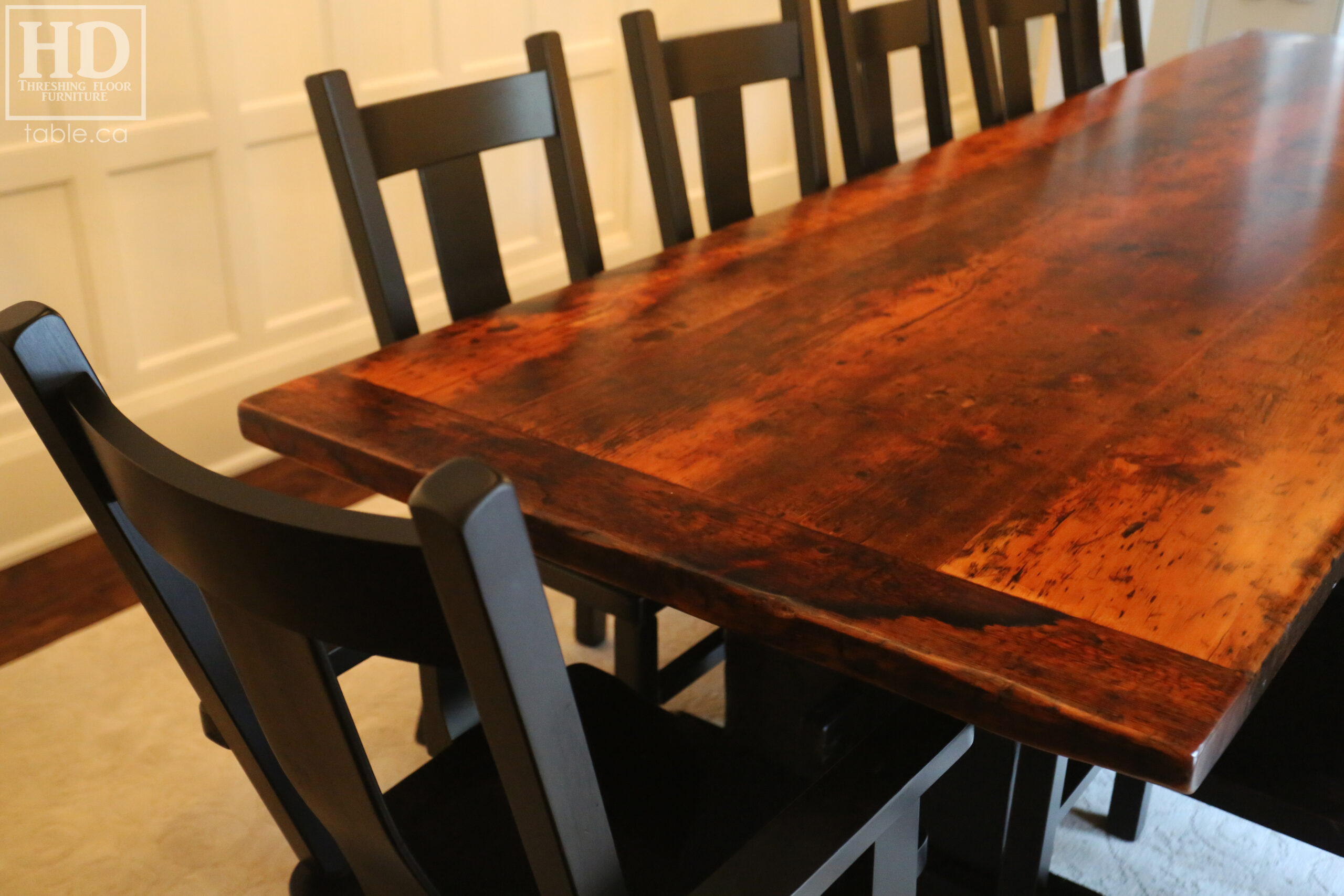 12' Reclaimed Wood Table for a Port Dover home - 42" wide - Trestle Base - 2" Old Growth Pine Threshing Floor Construction - Original edges & distressing maintained - Premium epoxy + satin polyurethane finish - Black Painted Base - 12 Plank Back Chairs / Wormy Maple - Painted Solid Black / Satin polyurethane clearcoat finish - www.table.ca