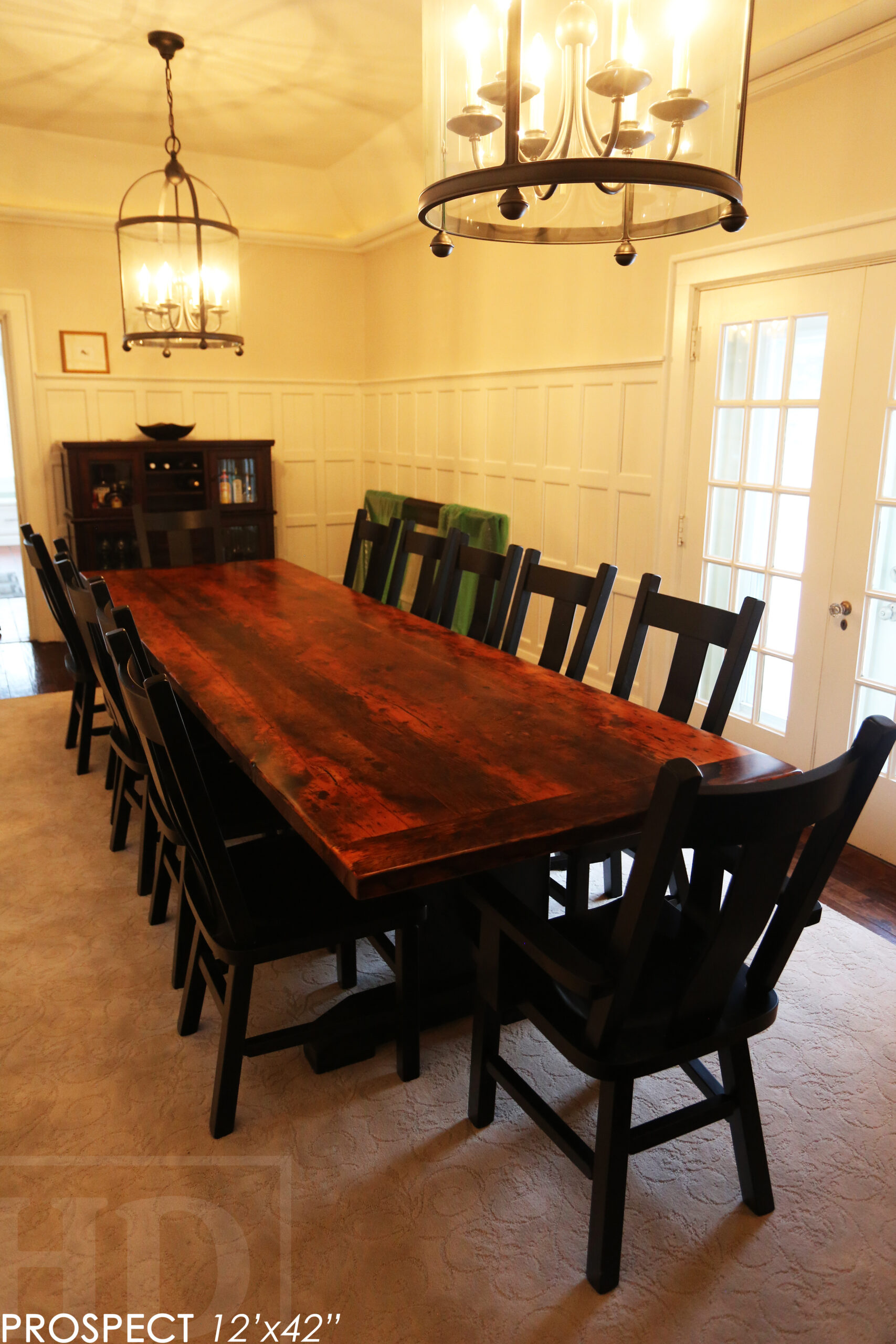 12' Reclaimed Wood Table for a Port Dover home - 42" wide - Trestle Base - 2" Old Growth Pine Threshing Floor Construction - Original edges & distressing maintained - Premium epoxy + satin polyurethane finish - Black Painted Base - 12 Plank Back Chairs / Wormy Maple - Painted Solid Black / Satin polyurethane clearcoat finish - www.table.ca