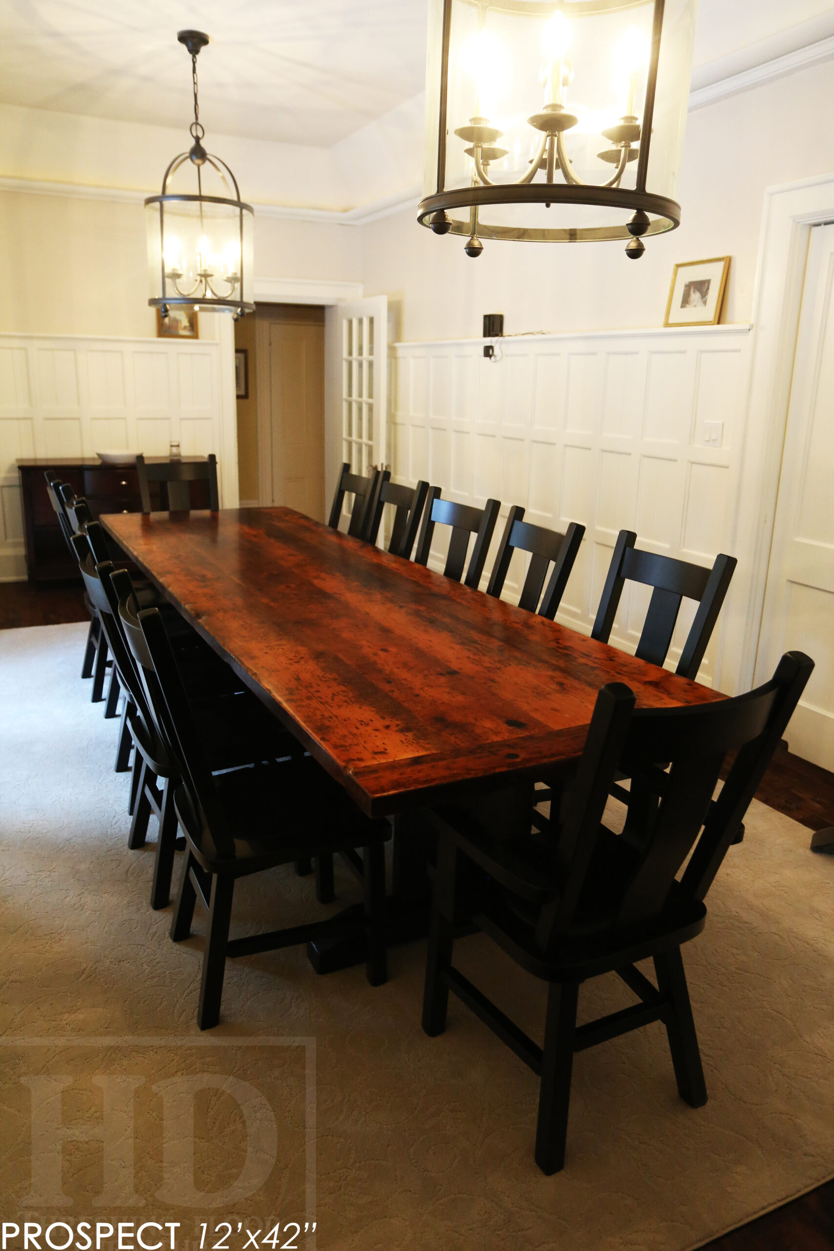 12' Reclaimed Wood Table for a Port Dover home - 42" wide - Trestle Base - 2" Old Growth Pine Threshing Floor Construction - Original edges & distressing maintained - Premium epoxy + satin polyurethane finish - Black Painted Base - 12 Plank Back Chairs / Wormy Maple - Painted Solid Black / Satin polyurethane clearcoat finish - www.table.ca