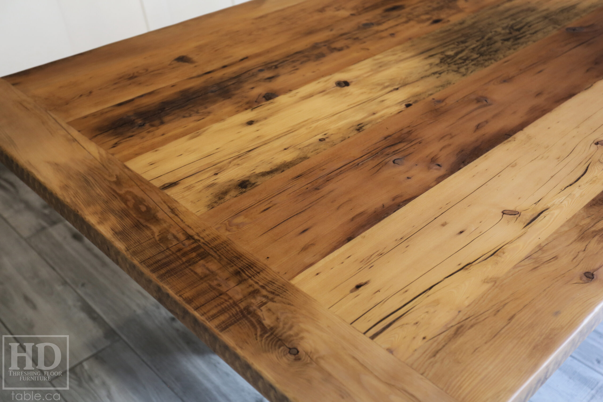 9' Reclaimed Wood Table for an Ancaster home - 48" wide - Hemlock Threshing Floor 2" Barnwood Top - Black X Shaped Metal Base - Original edges & distressing maintained - Premium epoxy + matte polyurethane finish - Greytone Treatment Option to maintain colour of unfinished - www.table.ca