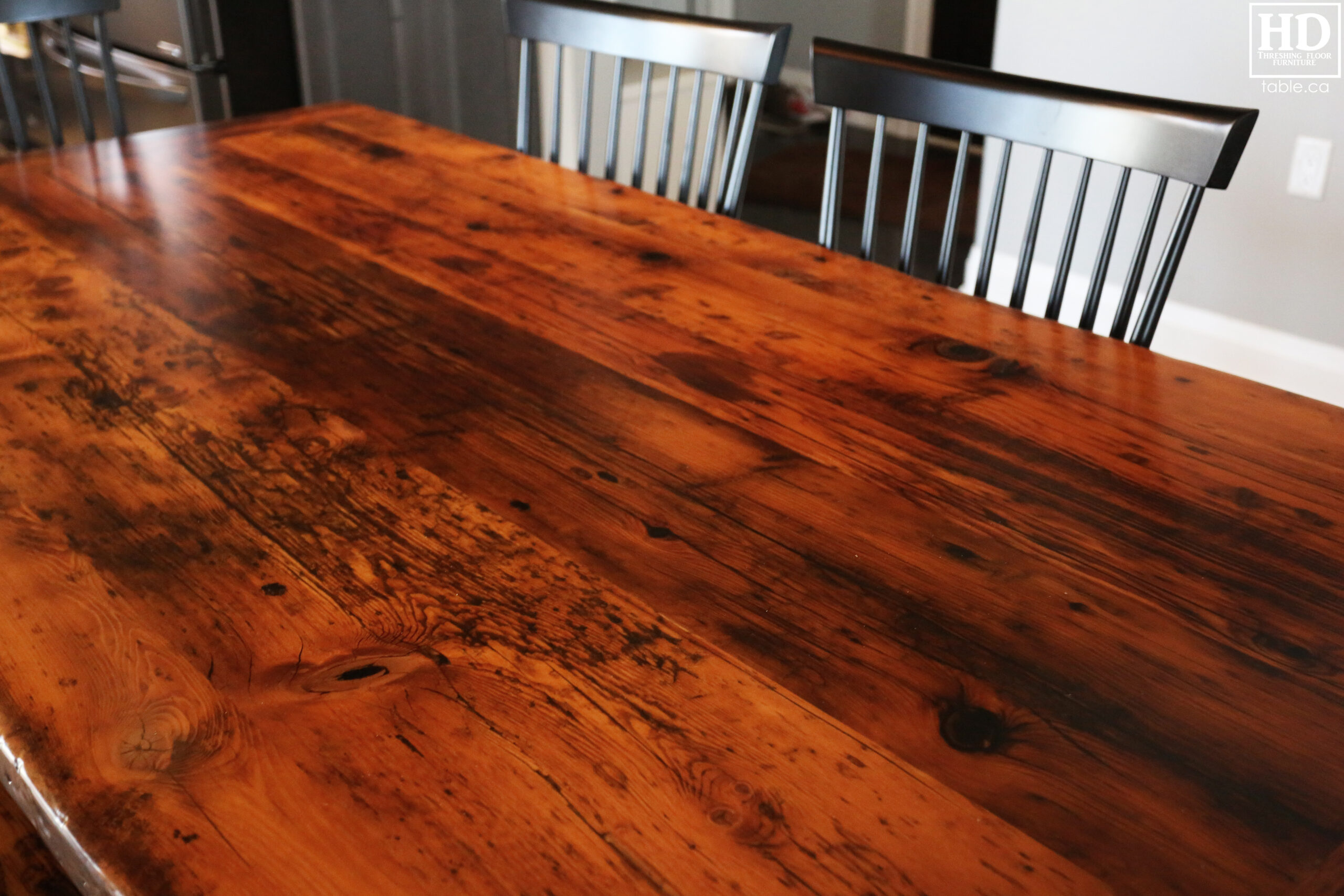 Details: 7' Reclaimed Wood Table we made for an Orono home - 42" wide - Trestle Base - Hemlock Threshing Floor Construction - Original edges & distressing maintained - Premium epoxy + satin polyurethane finish - 7' Reclaimed Wood Trestle Bench - [4] Shaker Chairs / Wormy Maple / Solid black / Polyurethane clearcoat finish / www.table.ca