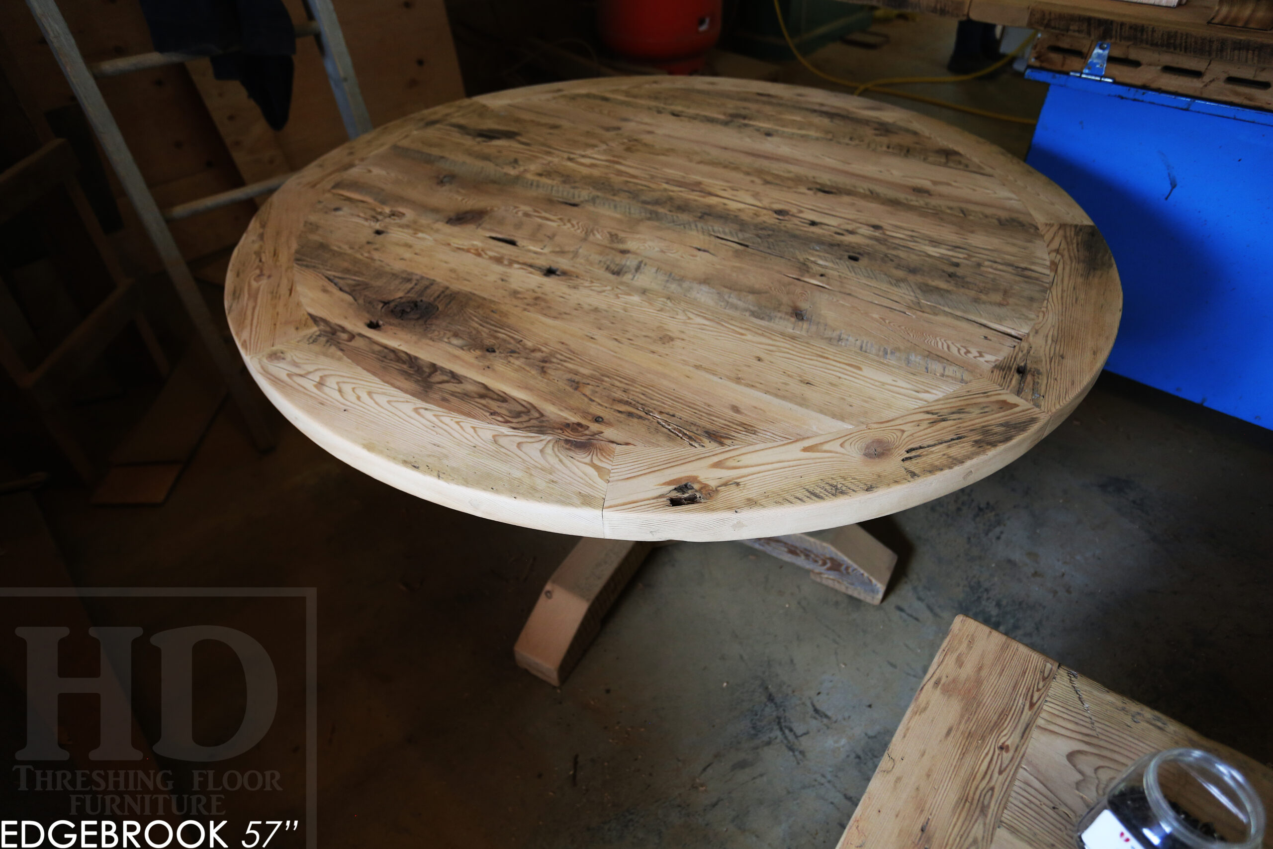 57" Reclaimed Wood Round Table we made for a Waterloo home - Hemlock Threshing Floor 2" Top - Original edges & distressing maintained - Cedar Hydro pole base - Premium epoxy + satin polyurethane finish / www.table.ca