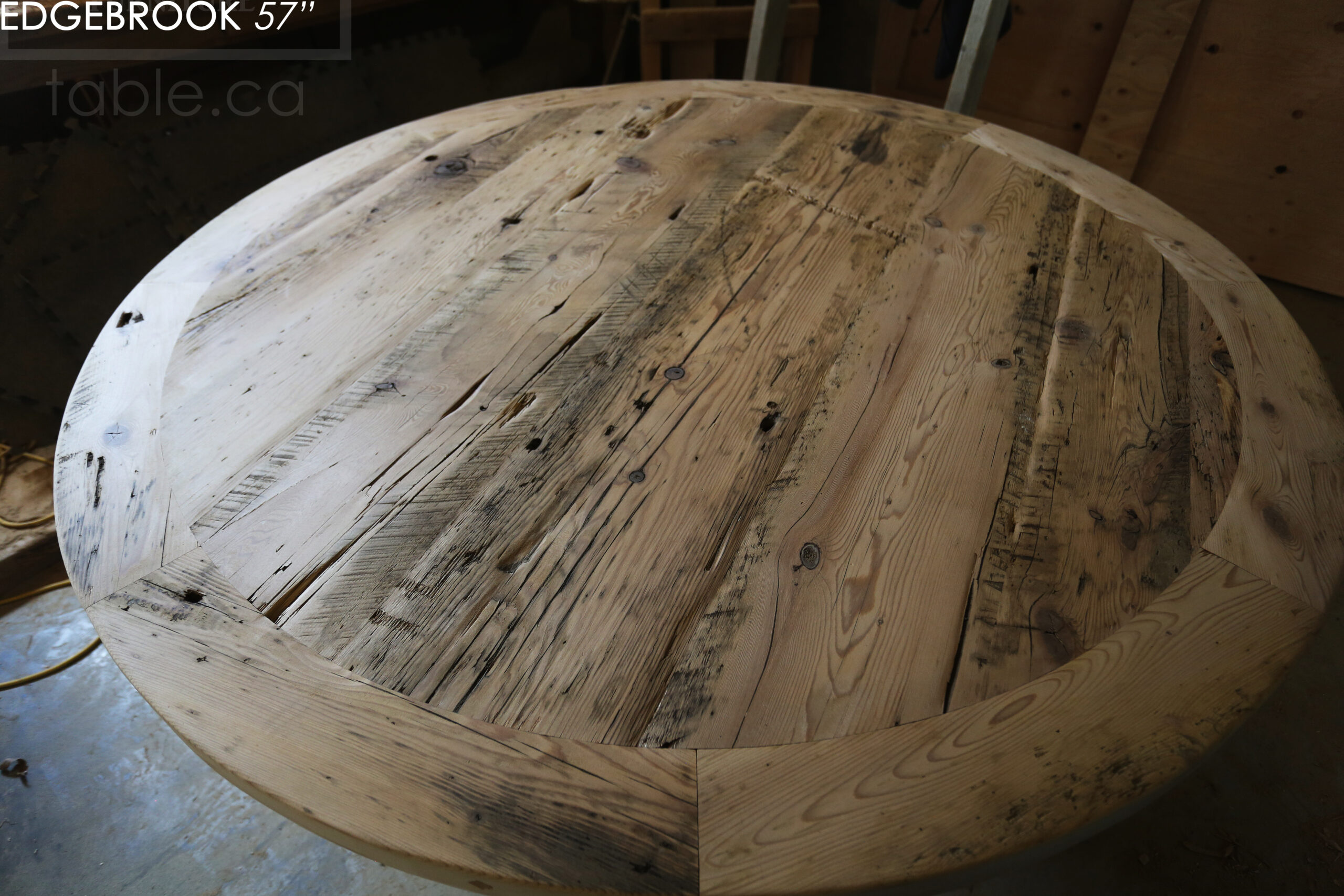 57" Reclaimed Wood Round Table we made for a Waterloo home - Hemlock Threshing Floor 2" Top - Original edges & distressing maintained - Cedar Hydro pole base - Premium epoxy + satin polyurethane finish / www.table.ca